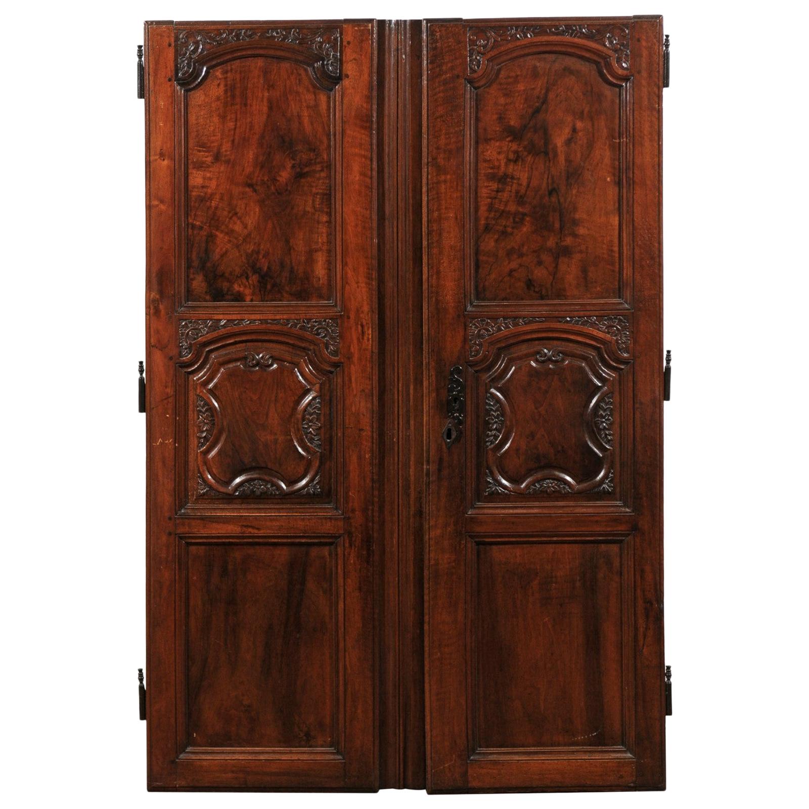 Pair of French Walnut Hand Carved Wooden Doors with Foliage Motifs, circa 1750