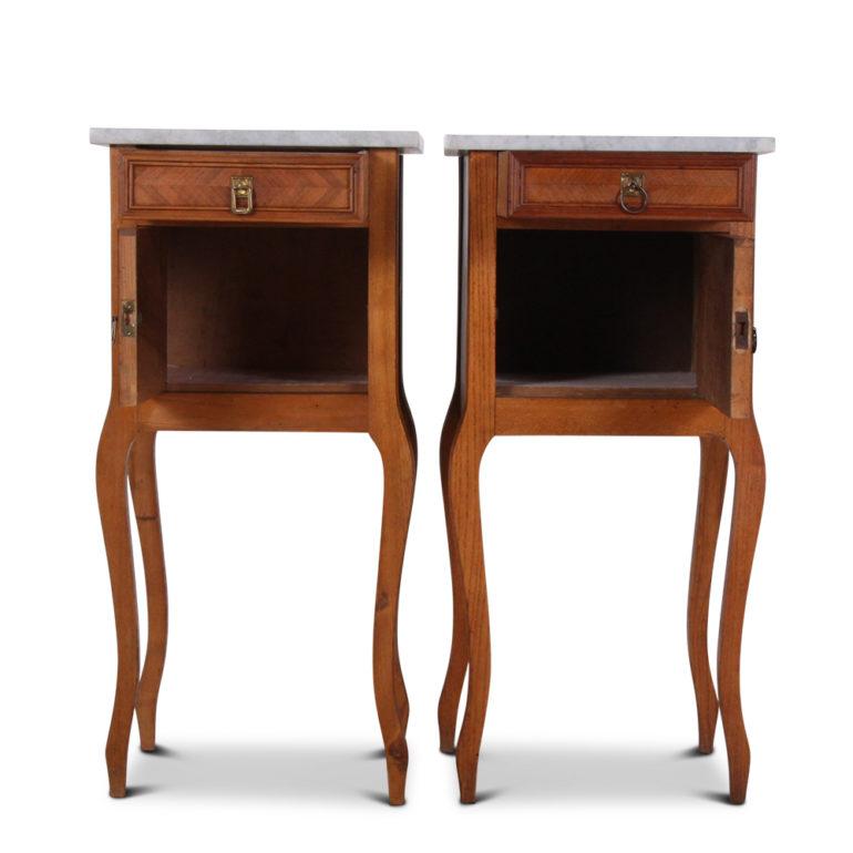 A pair of lovely marble-top walnut nightstands, with ample storage space within drawers and cabinet paired together with lovely curved legs.




                    