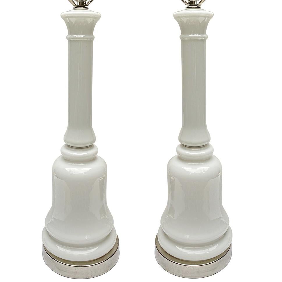 Pair of circa 1940's French white opaline table lamps with silver-plated bases.

Measurements:
Height: 20.5