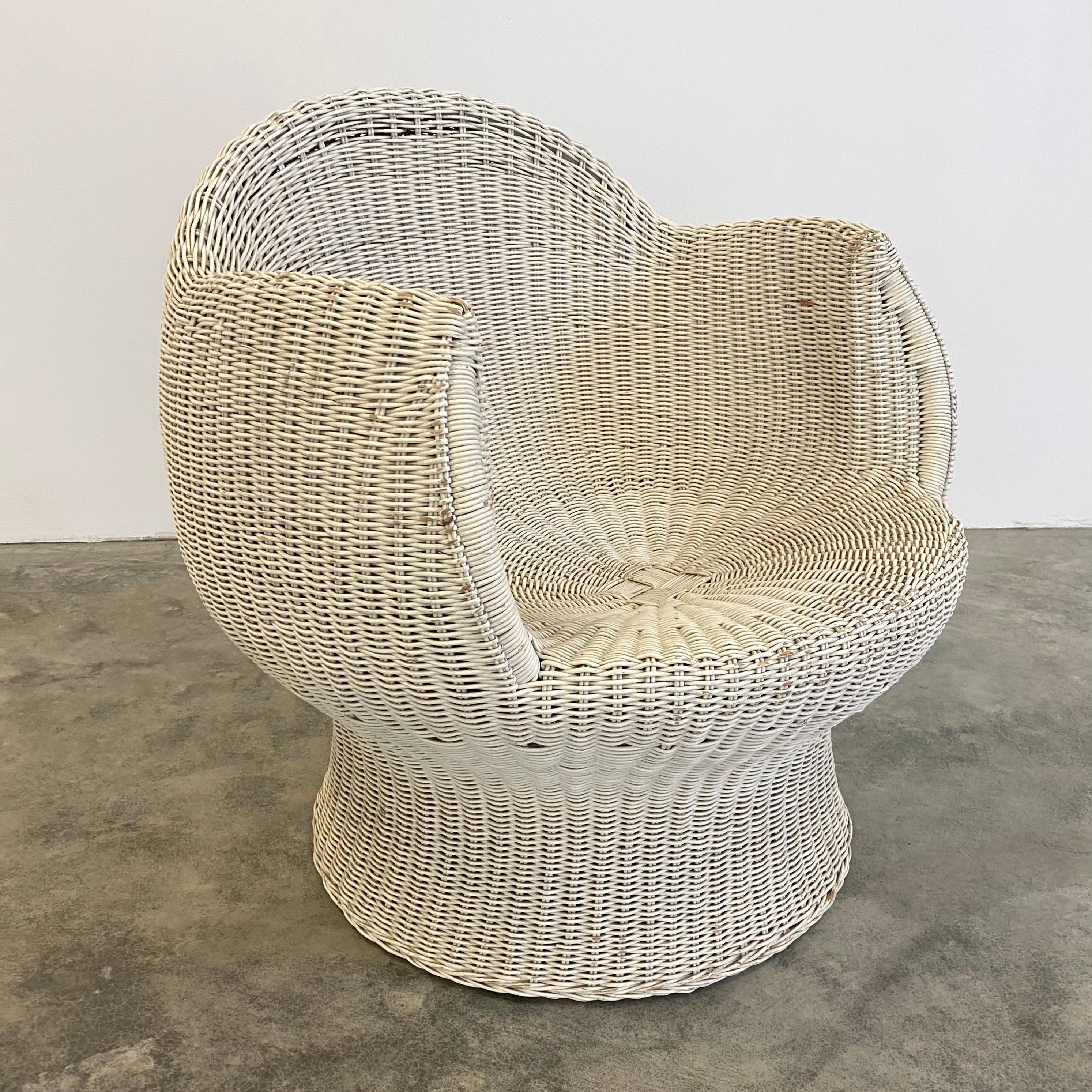 Sculptural pair of French wicker chairs. Circa 1960s. Featuring a woven white wicker frame. Great unusual shape. Good vintage condition. Wear as shown.
 