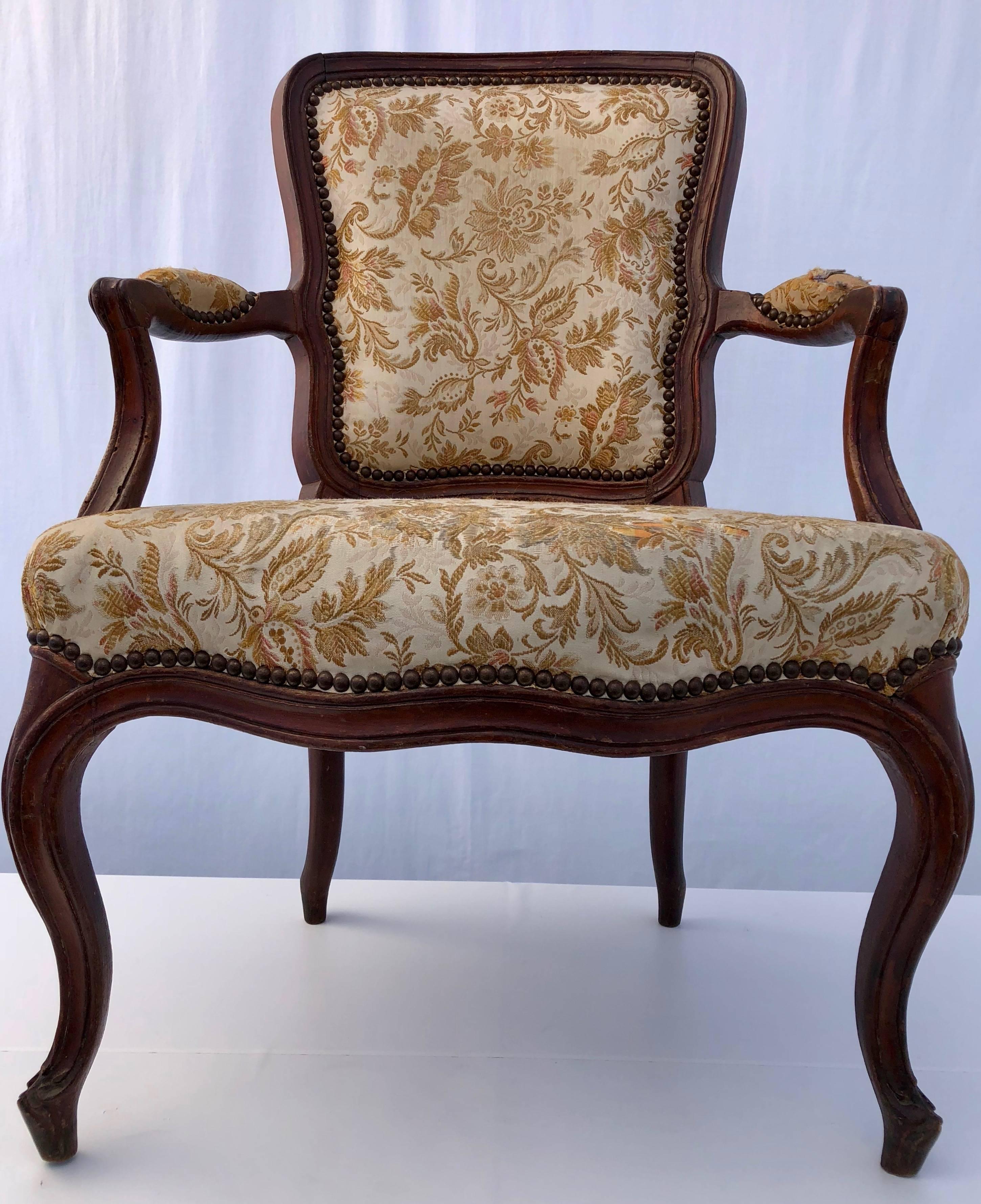 These are a great pair of French upholstered Regency style armchairs. They are very comfortable and well made. They are from the late 1800s.