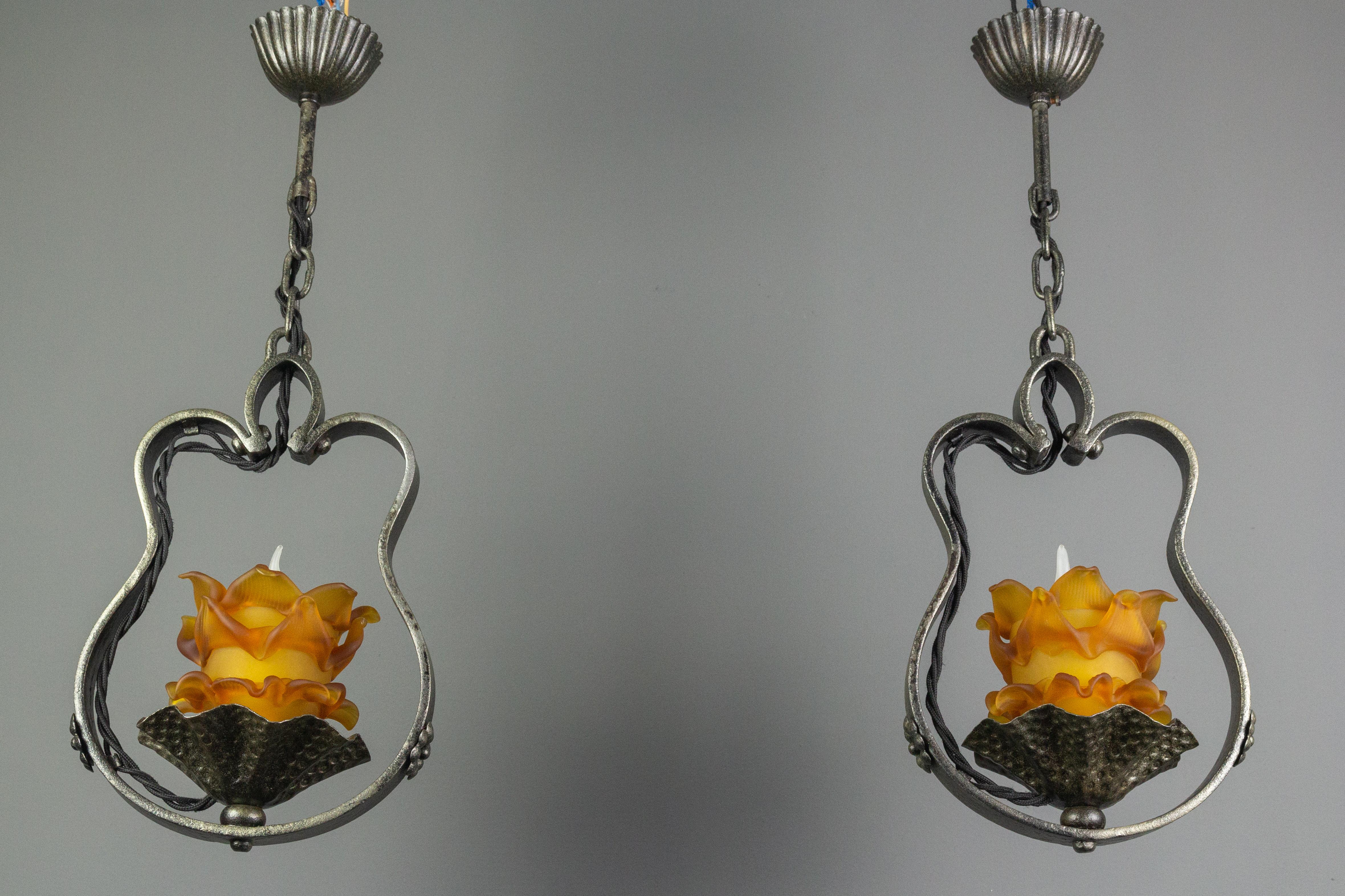 French Provincial Pair of French Wrought Iron and Orange Glass Flower Shaped Pendant Lights