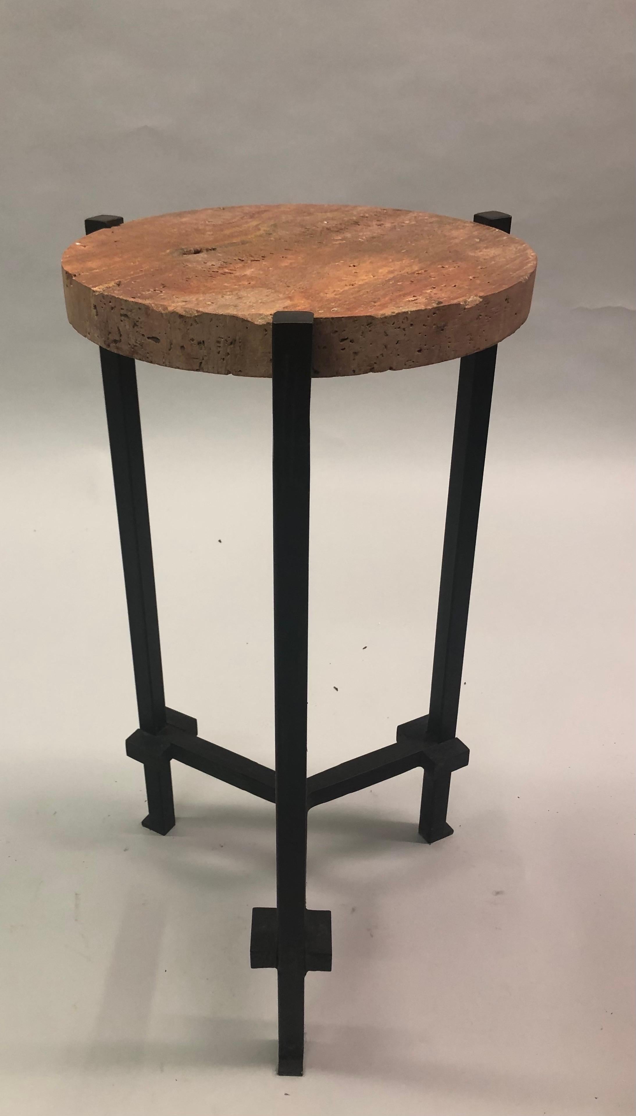 Rare, elegant and timeless pair of French Mid-Century Modern neoclassical wrought iron side or end tables / guéridons attributed to Marc du Plantier. The tables are in a tripod form with detailed blocked, geometric feet; they feature thick, inset