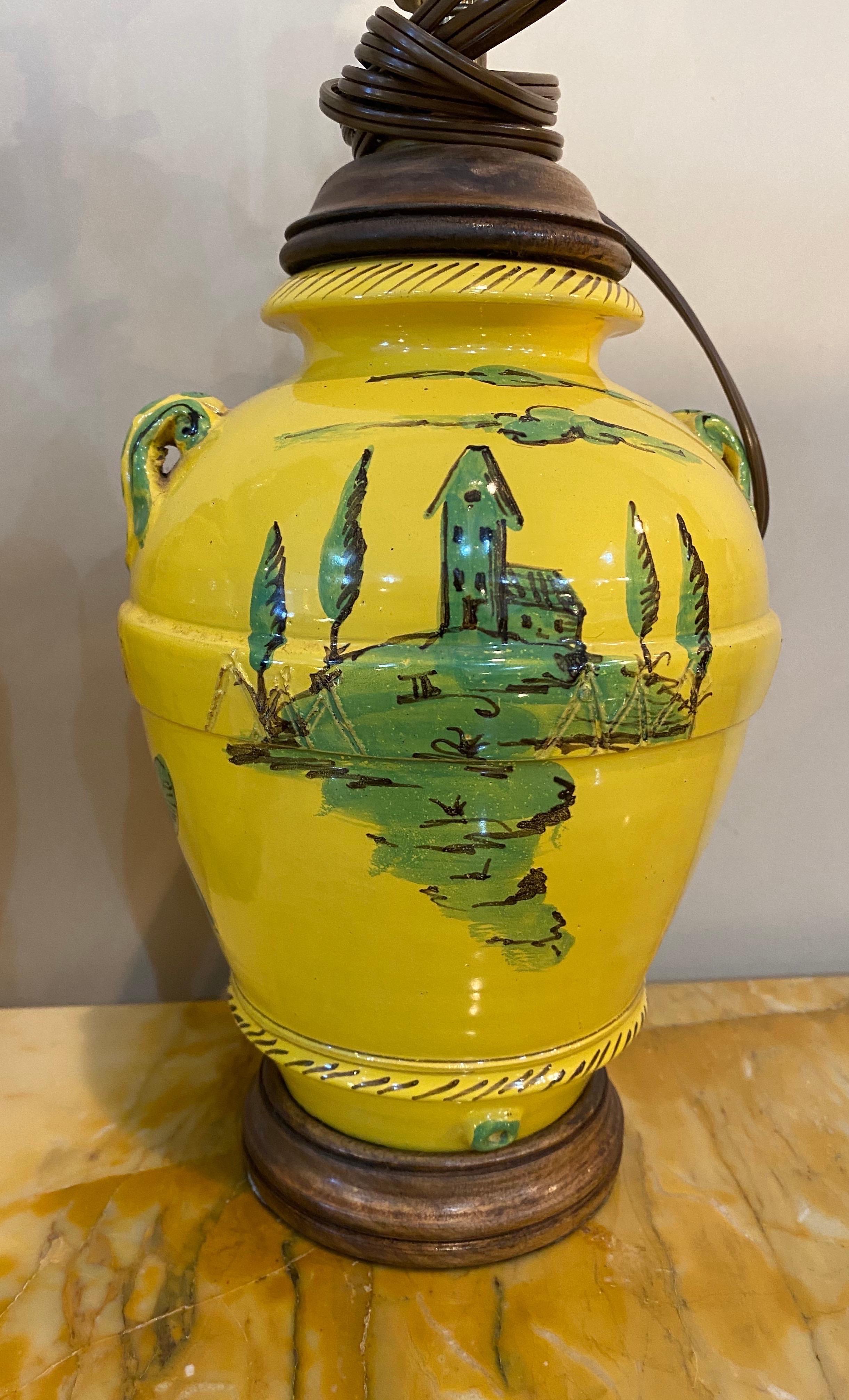 Great pair of French yellow and green vases mounted as lamps with scenes of a country estate and floral motifs.