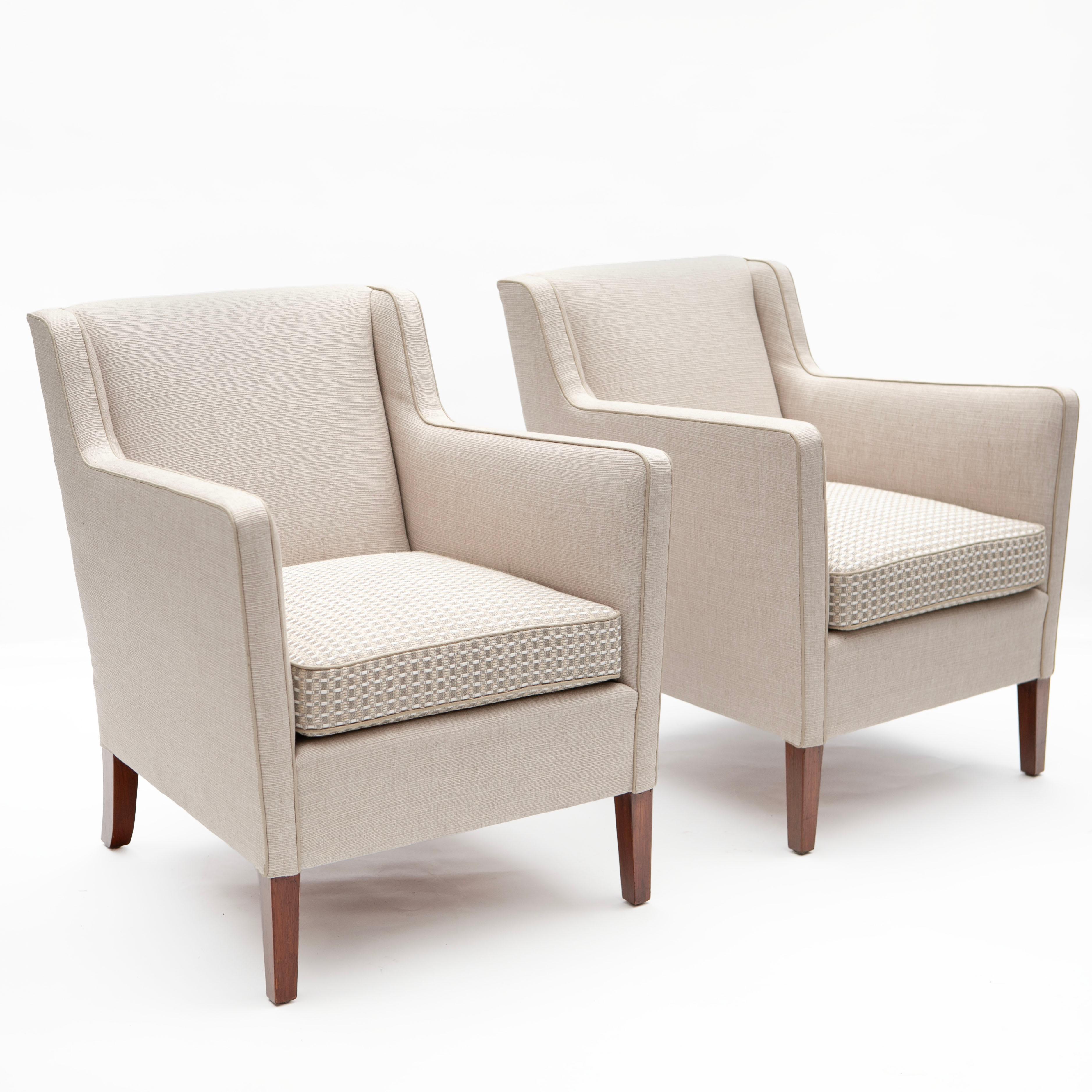 Pair of lounge chairs, designed and crafted by Frits Henningsen.

Newly upholstered with light sand colored textile from Larsen, featuring a upholstered cushion with check pattern , these chairs stand on tapered mahogany legs.

Denmark, 1950s
Sold