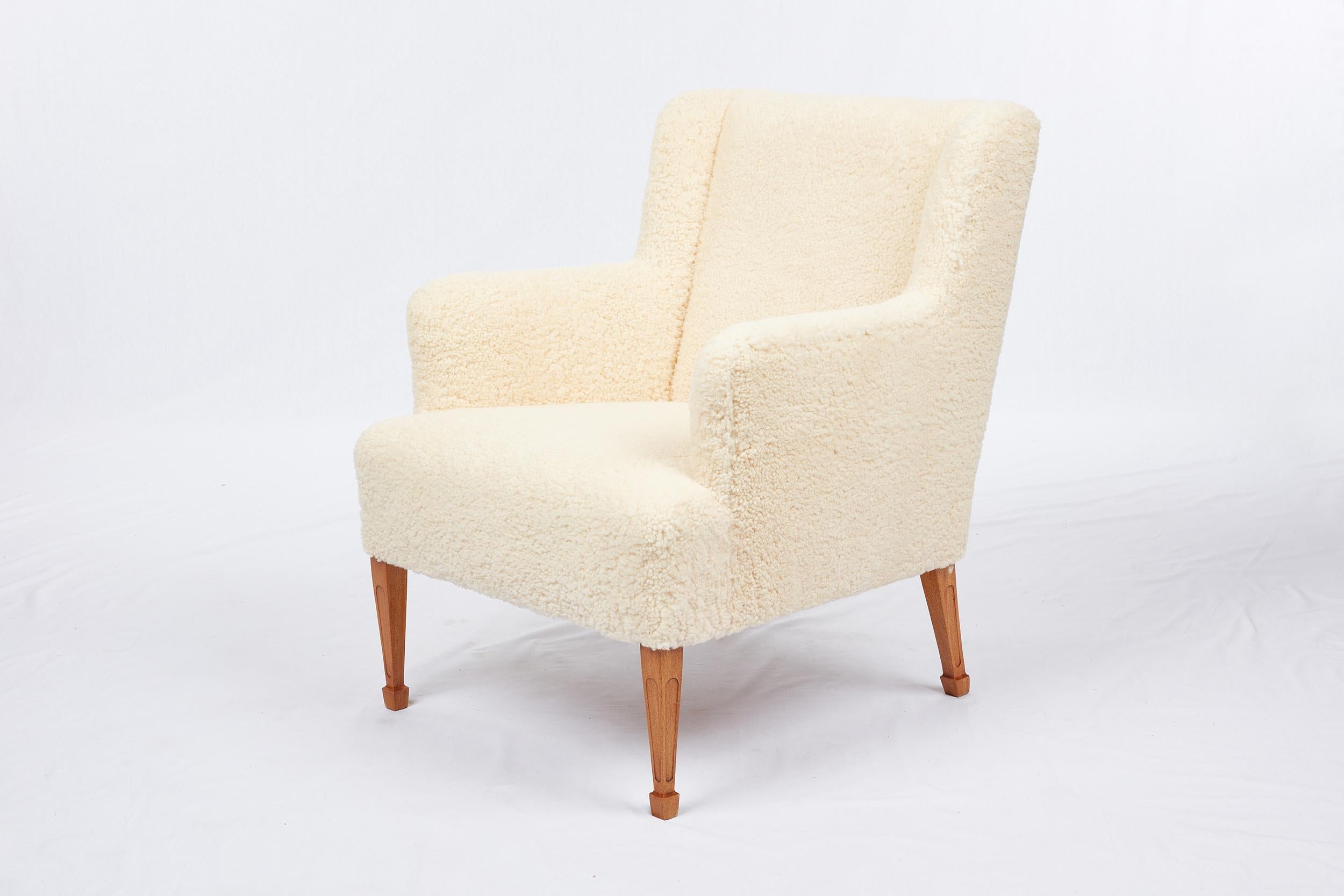 Pair of Frits Henningsen sheepskin lounge chairs.