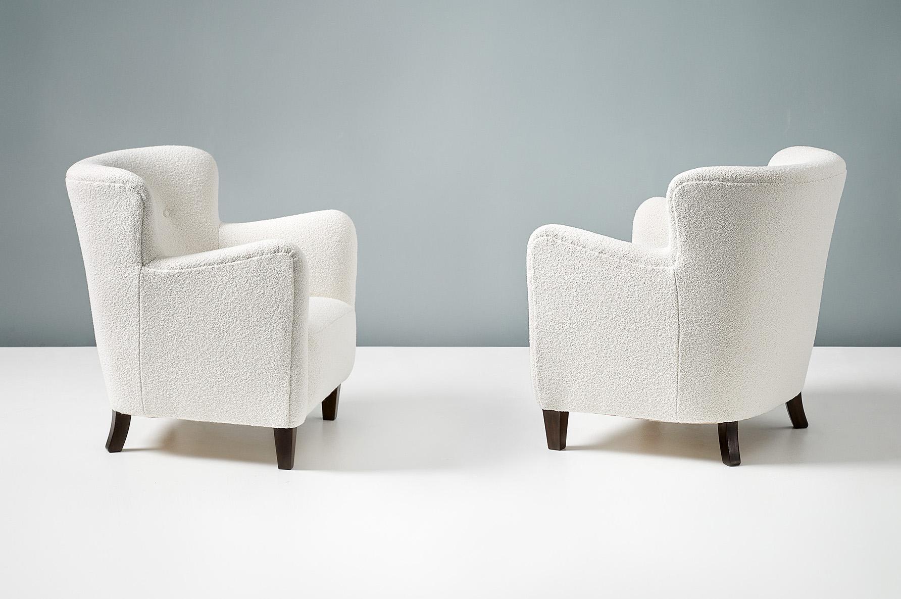 Fritz Hansen

Armchair, circa 1940s

Pair of armchairs by Fritz Hansen, produced in Denmark in the 1940s. The chars have tapered, stained beech front legs and have been reupholstered at our London workshops in off-white, cotton-wool blend boucle