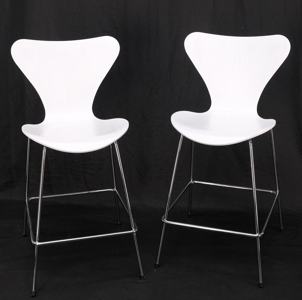 Pair of Fritz Hansen Ant Seats high bar stools chairs in white.