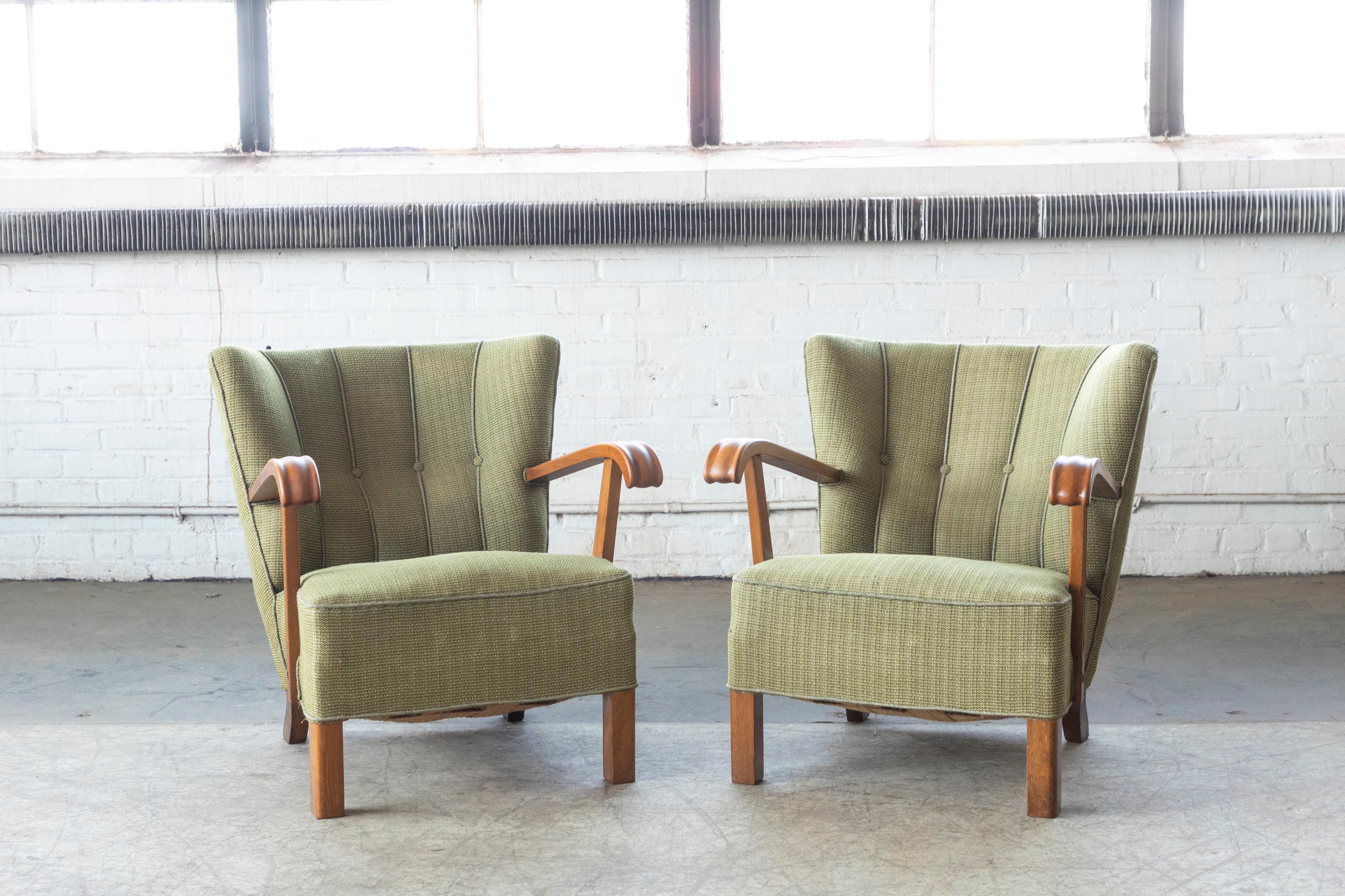 Pair of elegant and charming easy chairs from the late 1940svery typical of Fritz Hansen's design style both in terms of legs and armrests leading many dealers in Denmark to believe the chairs are indeed by Fritz Hansen. But nobody knows for sure.