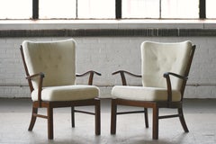 Pair of Fritz Hansen Lambswool covered Spindle Back Open Armrest Lounge Chairs