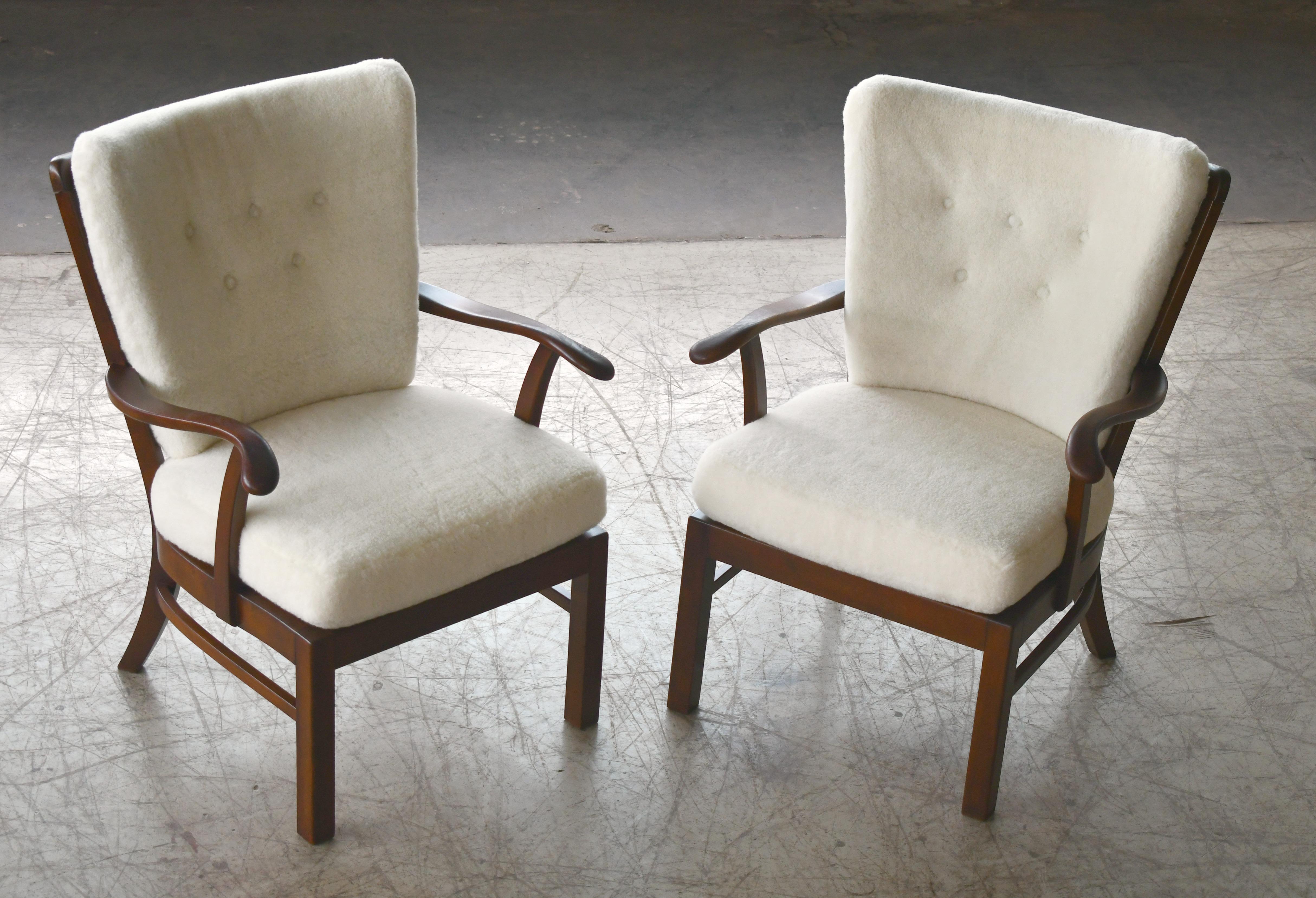 Pair of Fritz Hansen Lambswool covered Spindle Back Open Armrest Lounge Chairs In Good Condition In Bridgeport, CT