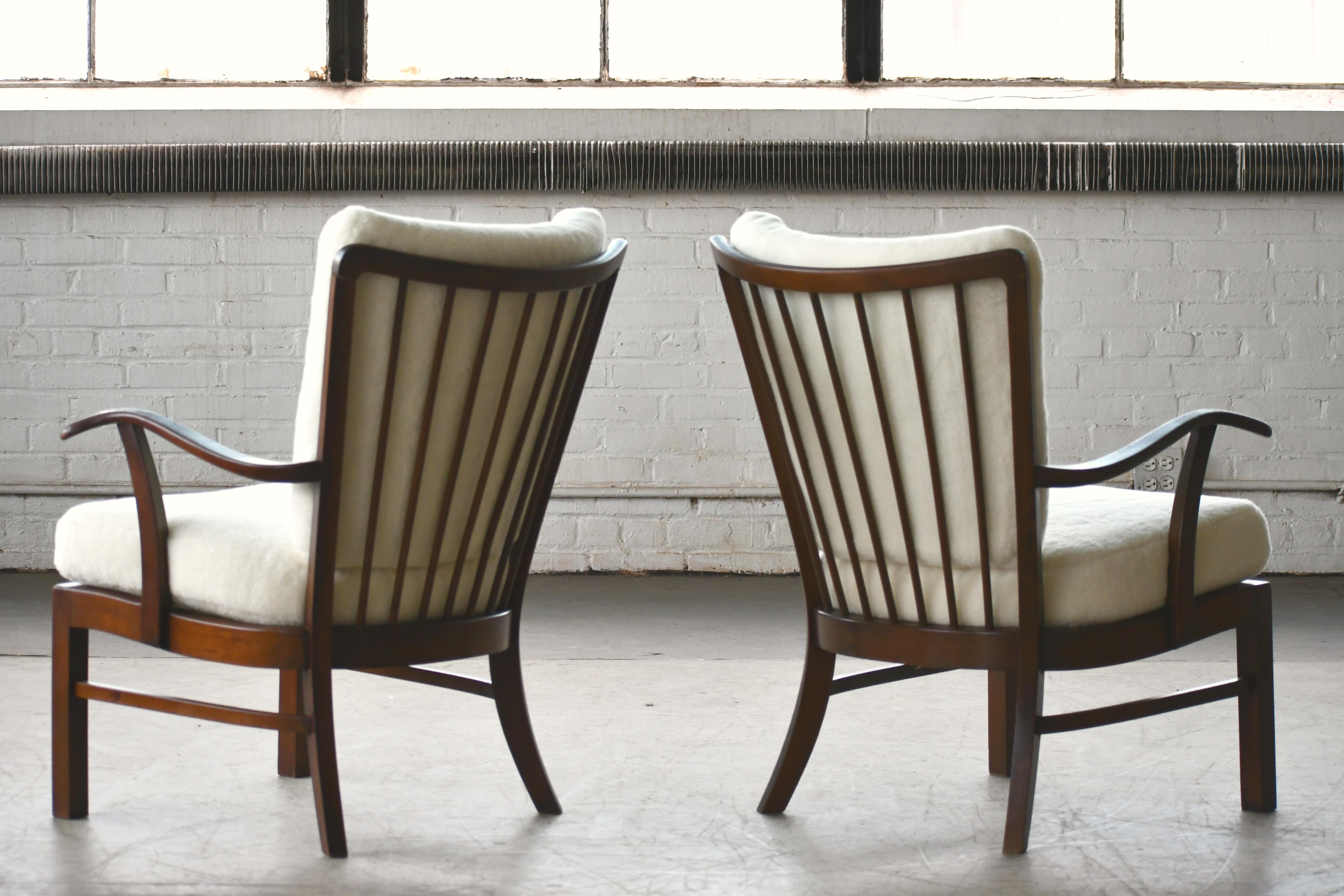 Mid-20th Century Pair of Fritz Hansen Lambswool covered Spindle Back Open Armrest Lounge Chairs