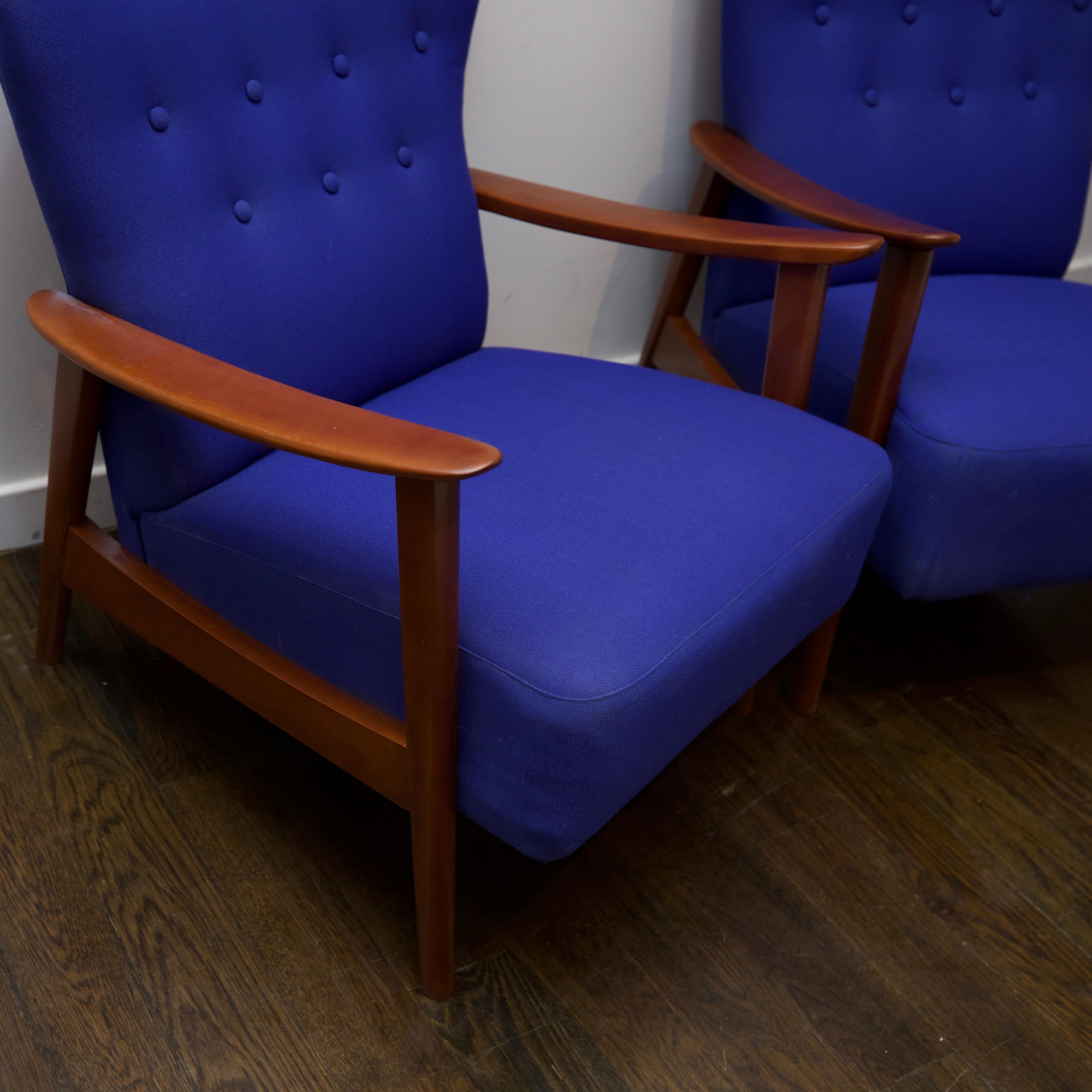 This is a fairly rare version by Danish designer Aksel Bender Madsen. Frames has been refinished in a walnut stain and periwinkle colored upholstery is more than presentable. Aksel Bender Madsen, often known simply as Bender Madsen, (16 August 1916