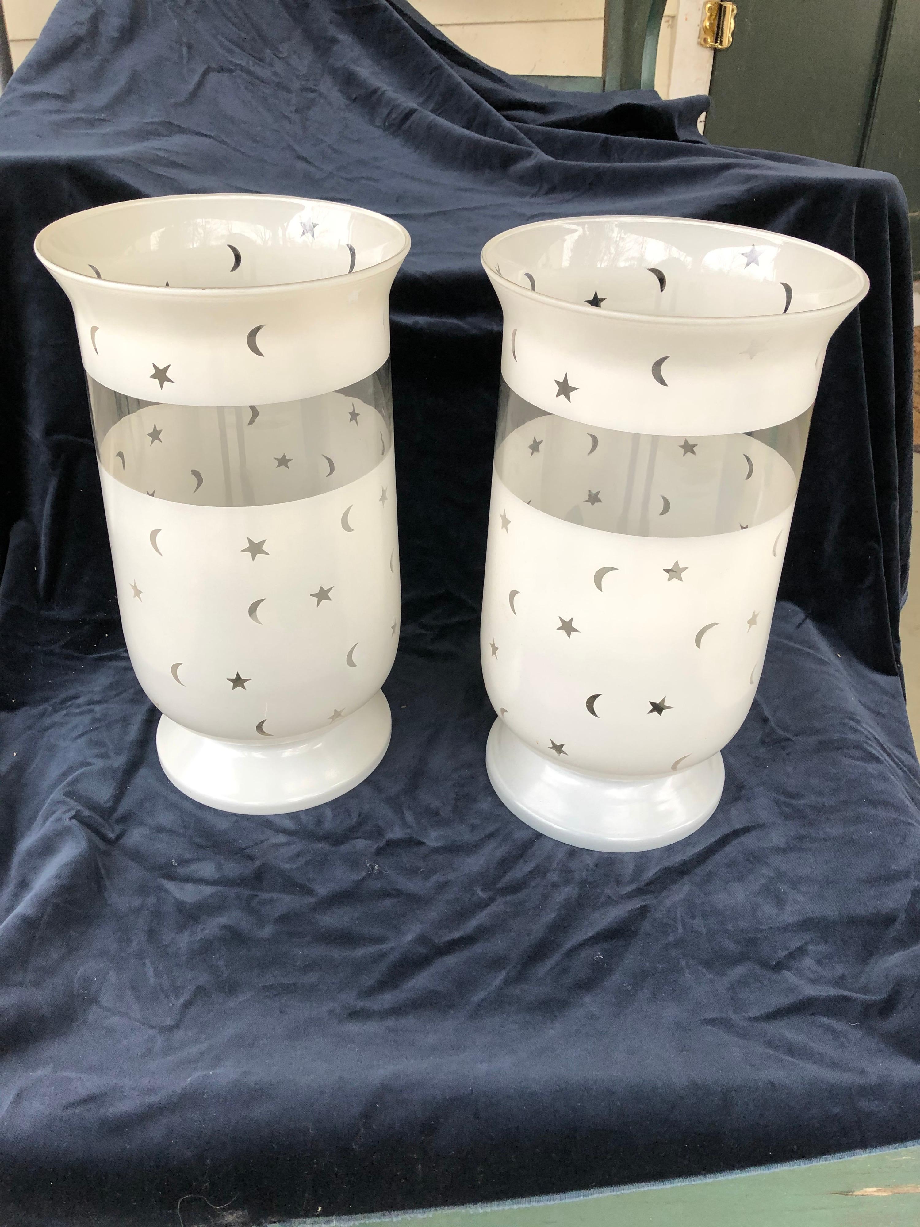 Handsome large scale pair of frosted glass hurricane shades with moon and stars decoration. Modern. Minor wear and a few abrasions otherwise in excellent shape. Solid bottoms to shades so a candle can be placed inside the shade.