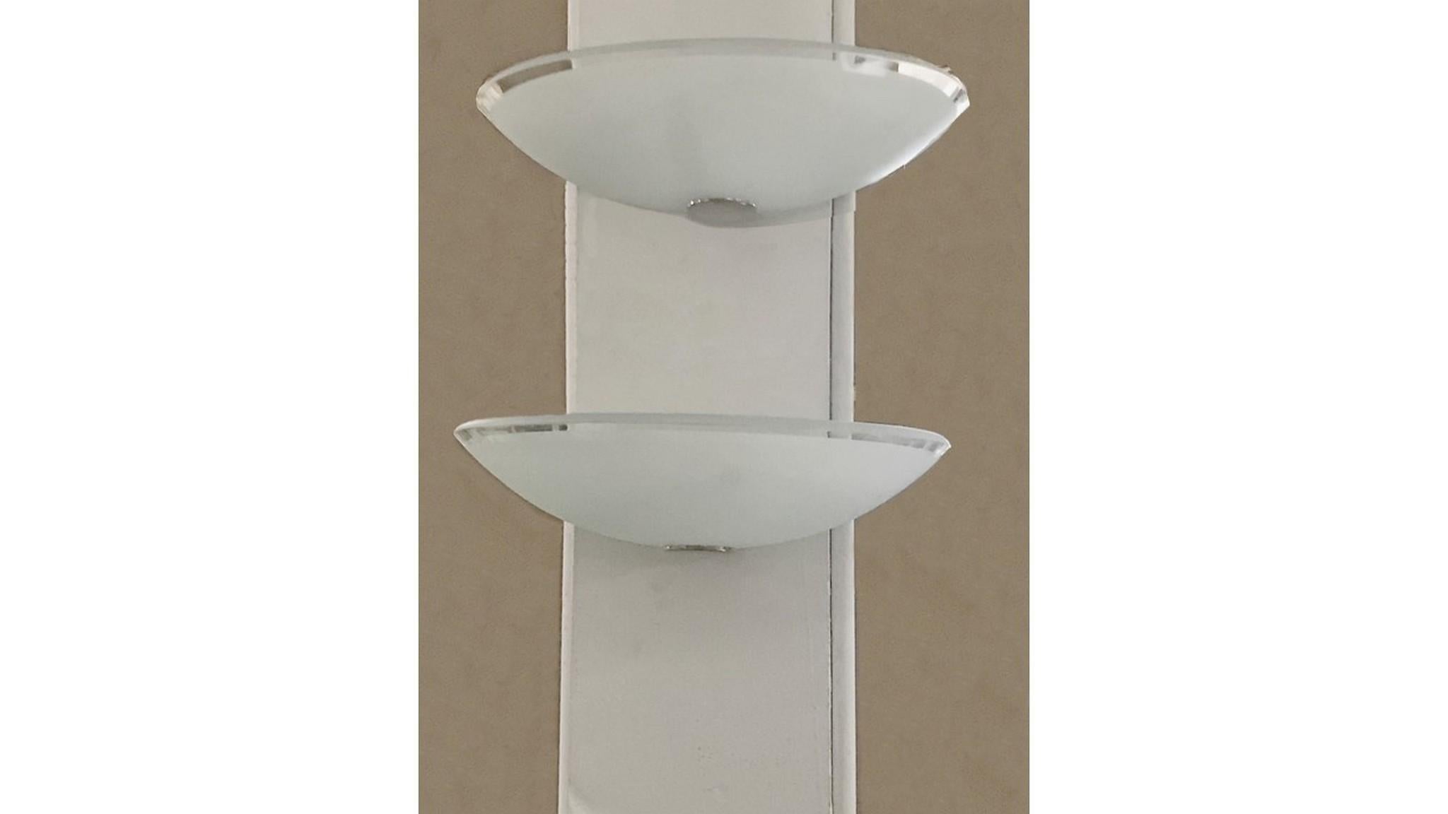 Mid-Century Pair of Lightolier sconces made of frosted glass is a clear glass edge and chrome hardware to hold it.