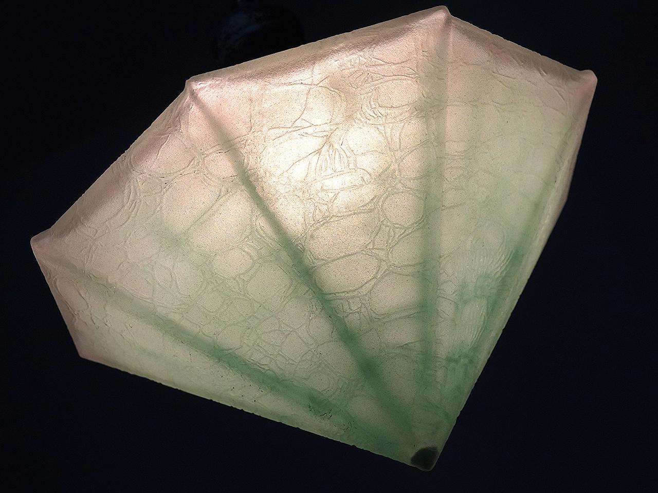 These unique lamps are offered as a matching pair. The pointed octagon shape is make these a real stand out. The heavy glass has a winkle texture and a frosted finish. In addition the shade holder has a green verdigris patina that complements the