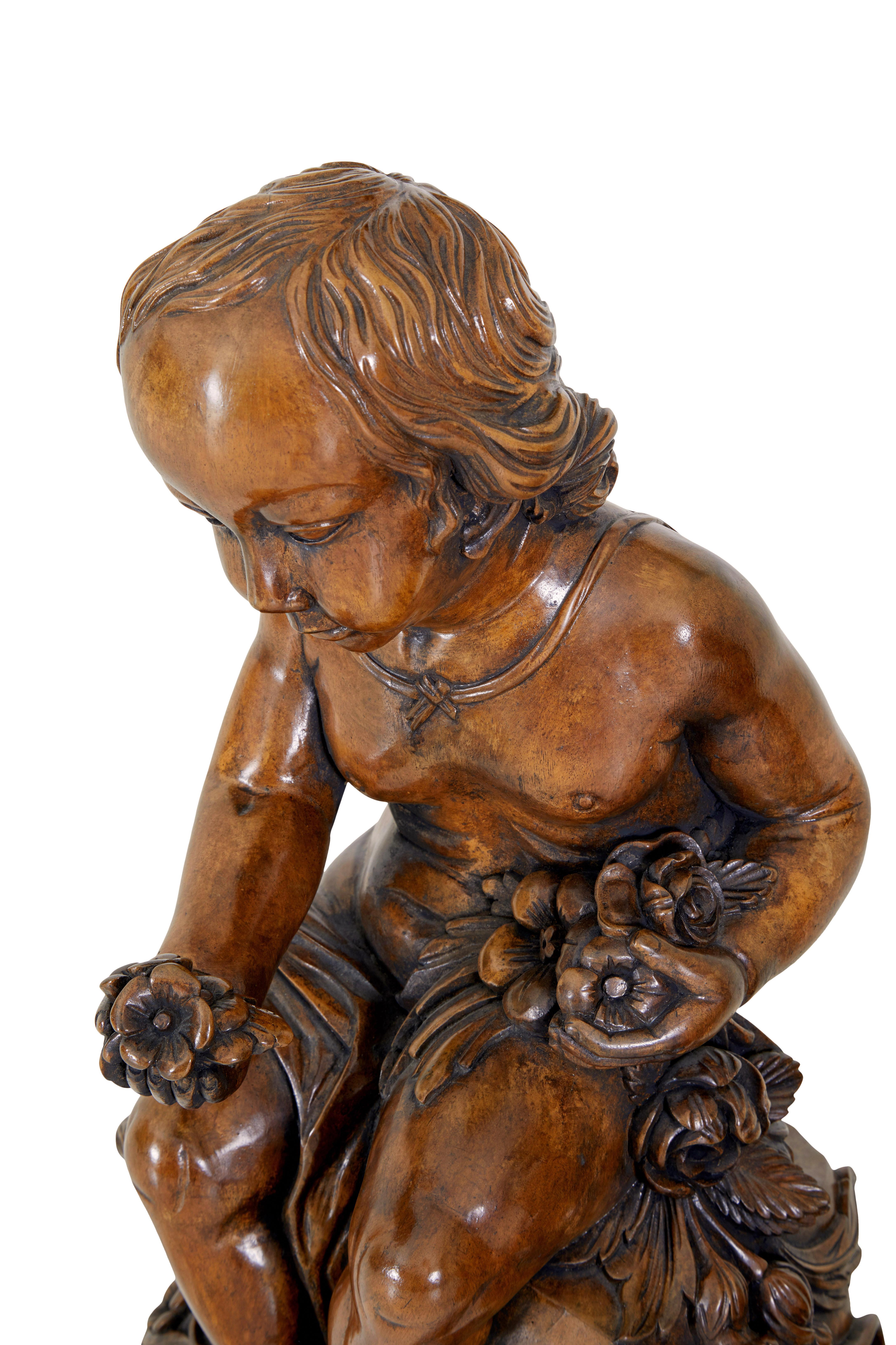 Pair of gothic revival carved cherubs circa 1970.

Good quality pair of hardwood cherubs which are coloured to match walnut.

Each figure seated on a plinth base of carved rock, tree and flowers.

Ideal pieces for decoration, shop fitting or film
