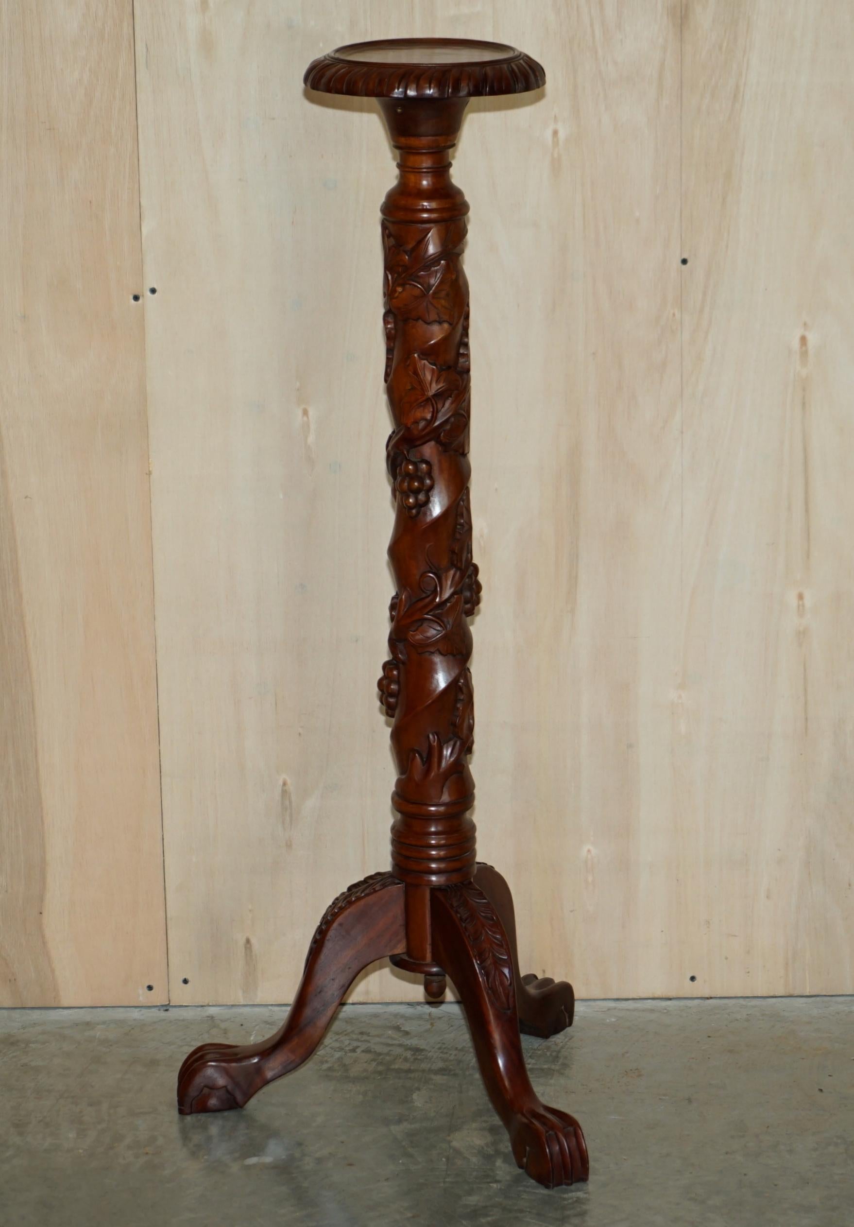 We are delighted to offer for sale this lovely pair of hand carved Fruitwood vine pillars with floral detailing

A very well-made pair, they are vintage with lovely claw & ball feet, the main pillars are fruit vine carved and must have take a