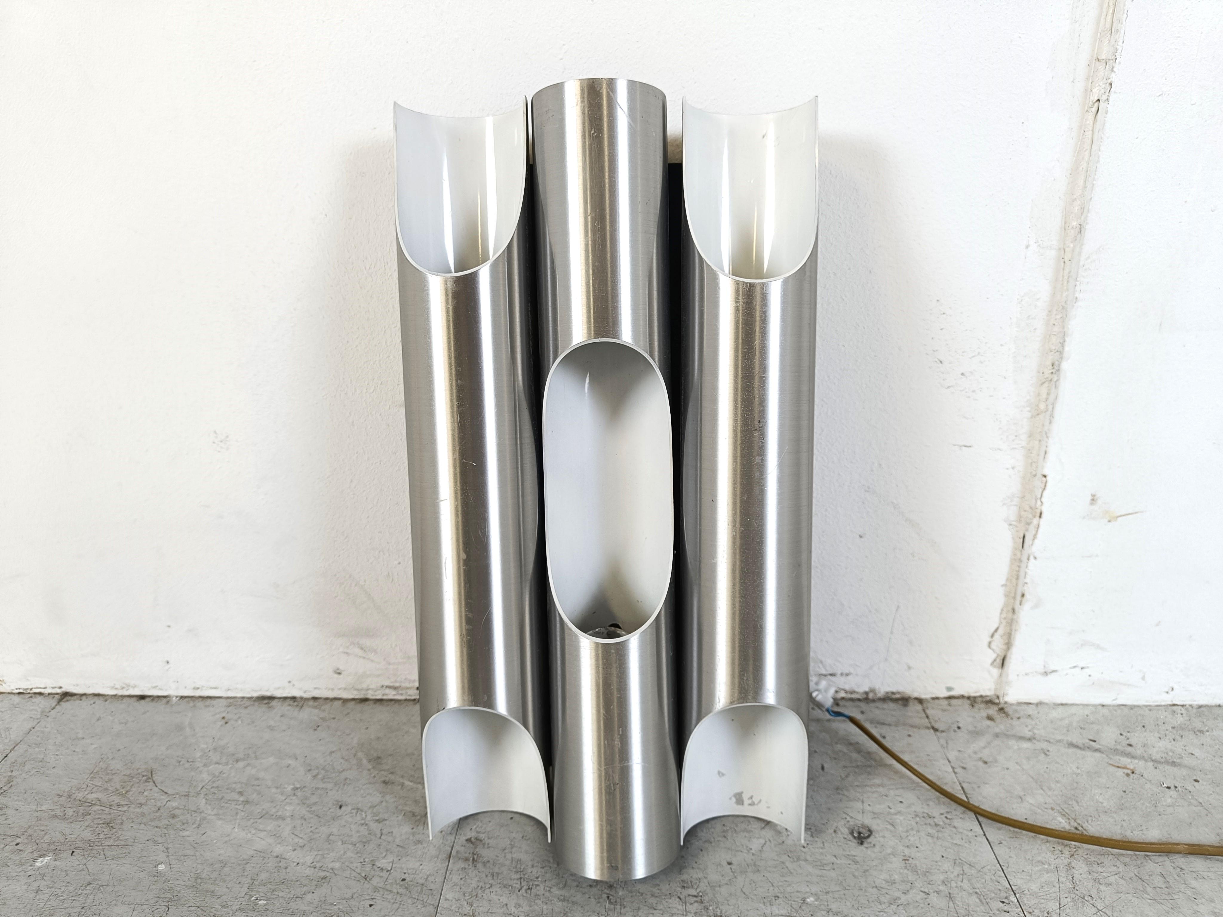 These Fuga wall lamps from Raak were designed by the architect and industrial designer Maija Liisa Komulainen in Finland in 1964. 

The design shows similarities with organ pipes. 

This lamps give indirect light.

1960s - The