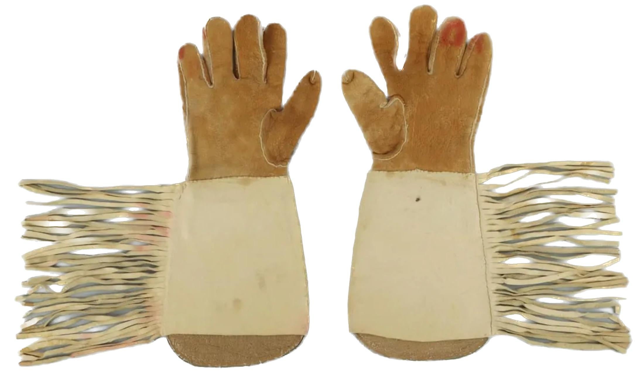 A pair of beaded gauntlets most likely Plateau, Nez Perce or Yakima.  6 X 8  fully beaded panels.  The beads are tight and none are missing. The leather on the gauntlets and fringe are soft. Size is large. Dimension: 16 X 6.6 inches. Fringe is 6.5