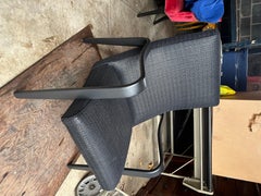 pair of fully refurbished mid-century arm chairs in custom woven leather