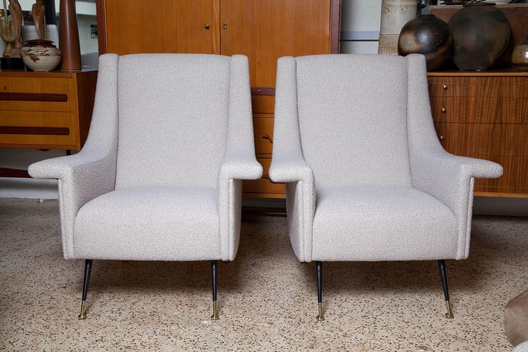 Large and comfy 1950s Italian lounge chairs, fully restored and upholstered in a soft, thick alpaca, wool, and silk blend in pale, pearly, greige. Black enameled legs with polished brass sabots.