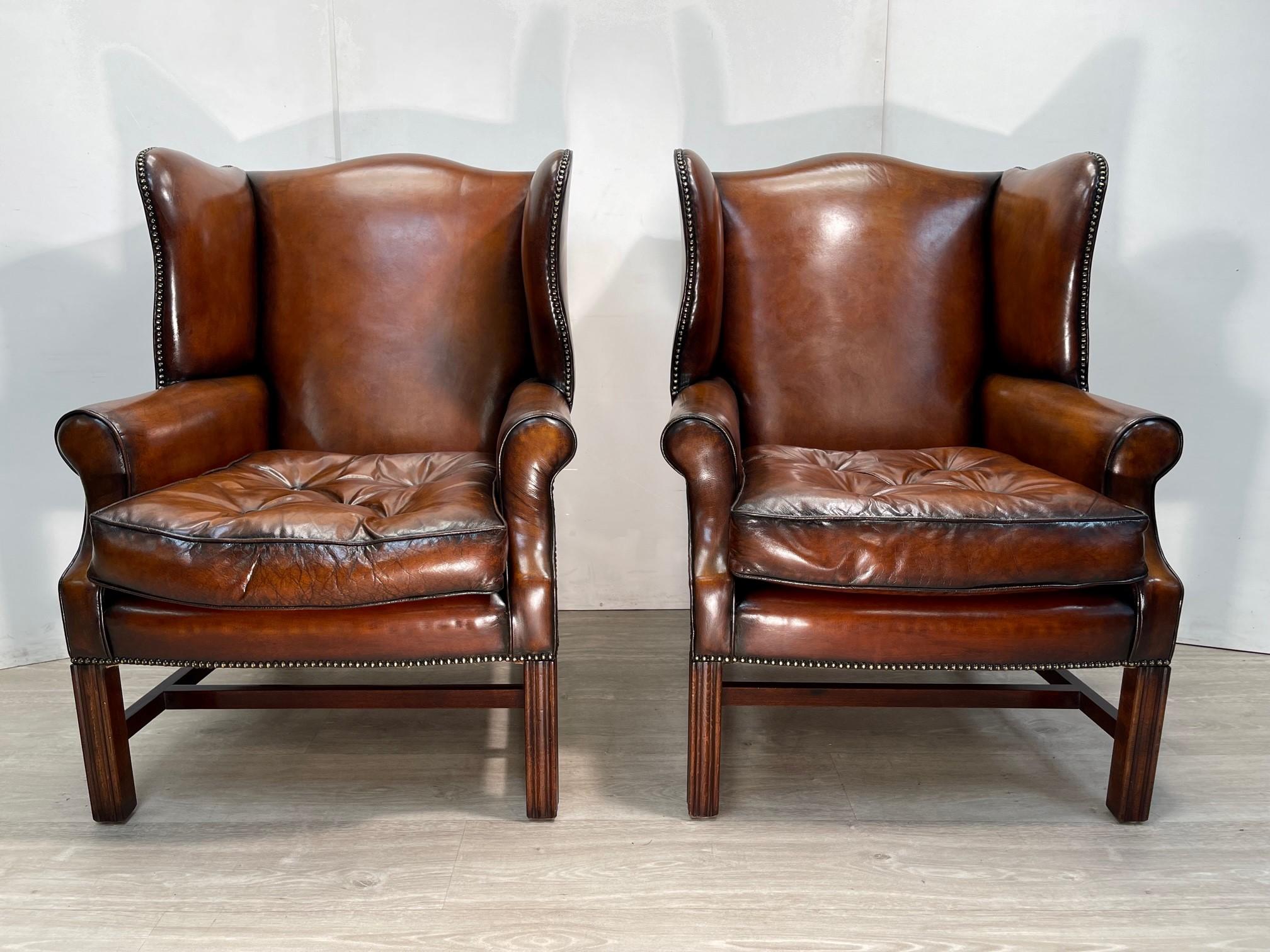 We are delighted to offer for sale this absolutely stunning pair of fully restored hand dyed cigar brown leather, Victorian style wingback armchairs with Thomas Chippendale floating button cushions that are feather filled
What a pair! These are