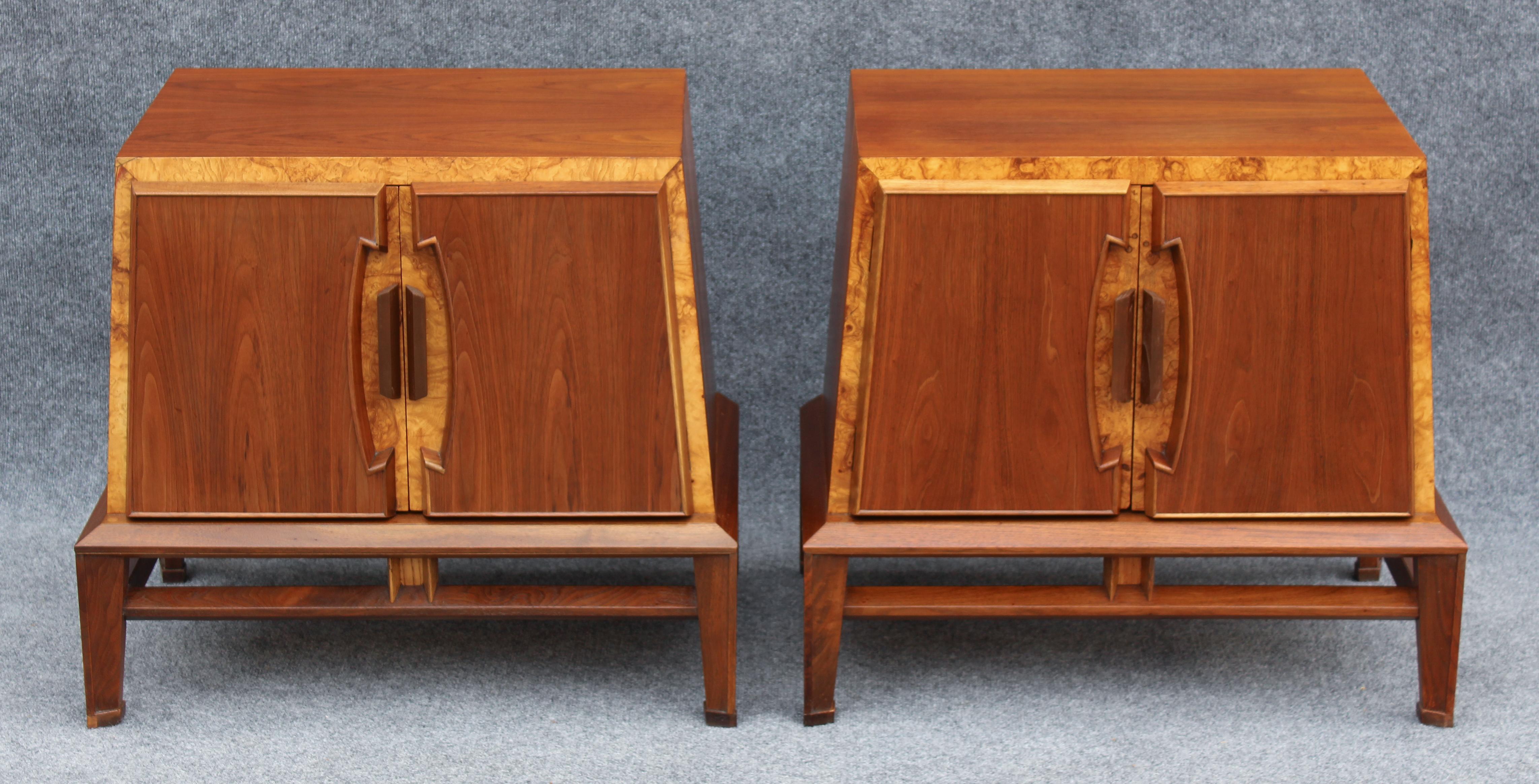 This rare and super sculptural pair of nightstands was designed in the 1970s by Helen Hobey for Baker. They feature a walnut and burlwood construction that is warm and pleasant to the eye. Sides that slope inward to meet the top, and an articulated