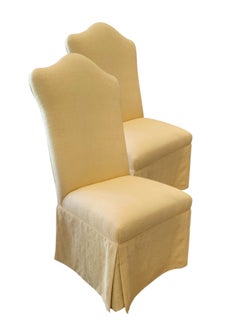 Pair of Fully Upholstered Skirted Chairs with Serpentine Backrest