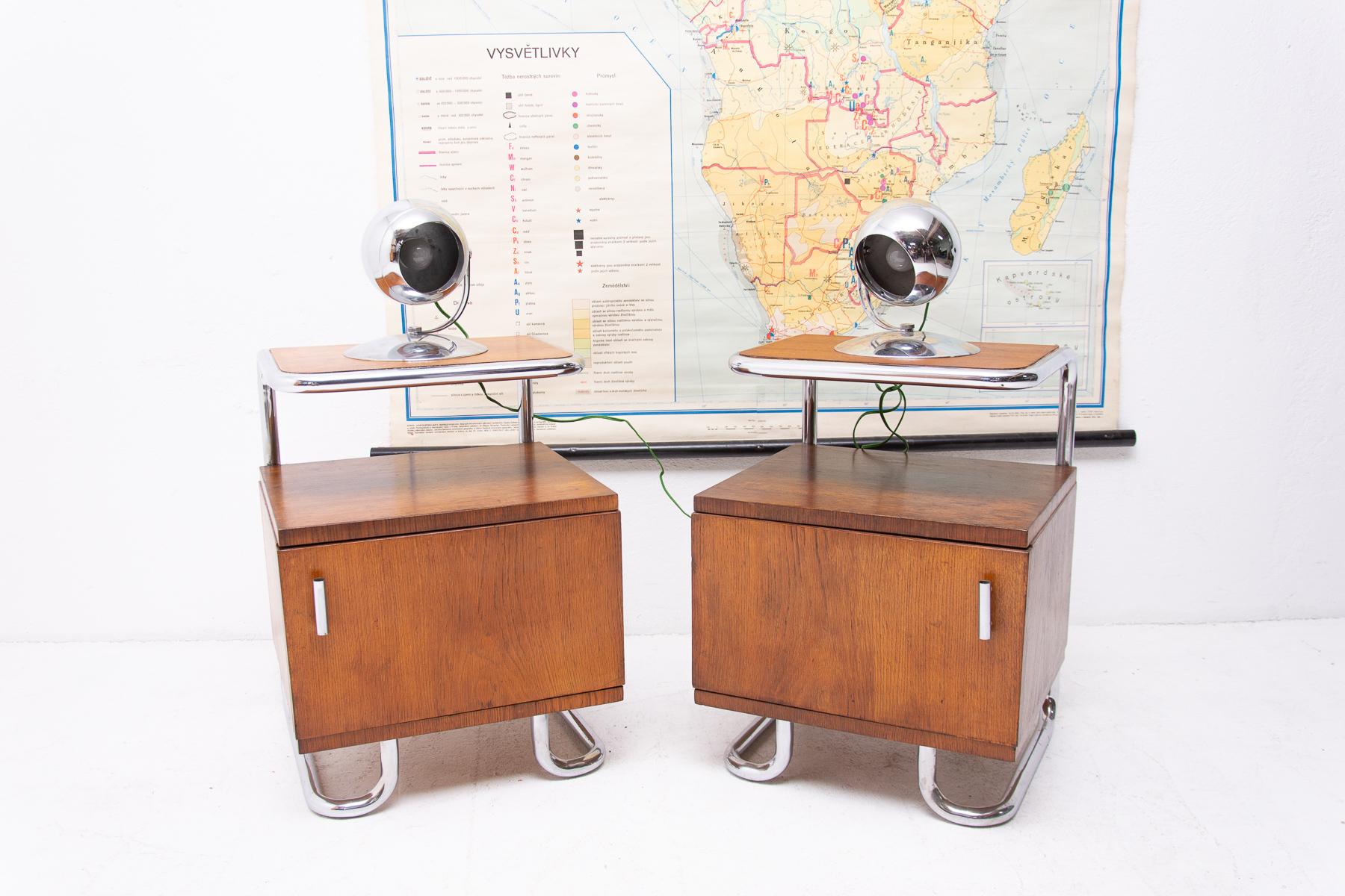 A pair of modernist nightstands in the Bauhaus style. Outstanding timeless design. Made in the former Czechoslovakia in the 1950s. It was produced by Kovona Company. A typical example of the Bauhaus period in Central Europe. Chrome is in very good