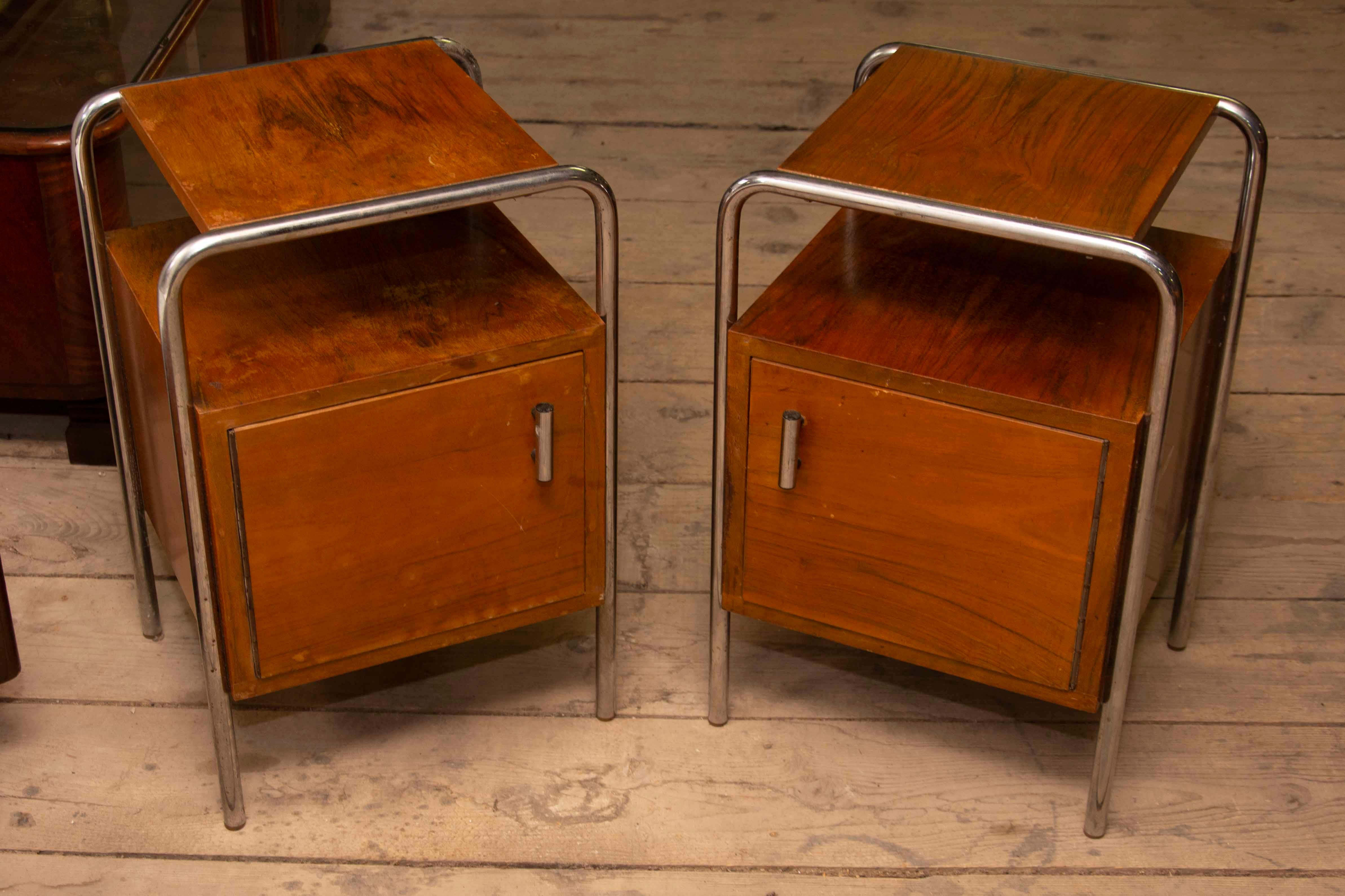 A pair of Minimalist nightstands in the Bauhaus style. Outstanding timeless design. Made in the former Czechoslovakia in the 1950s. It was produced by Kovona company. A typical example of the Bauhaus period in Central Europe. Chrome is in very good
