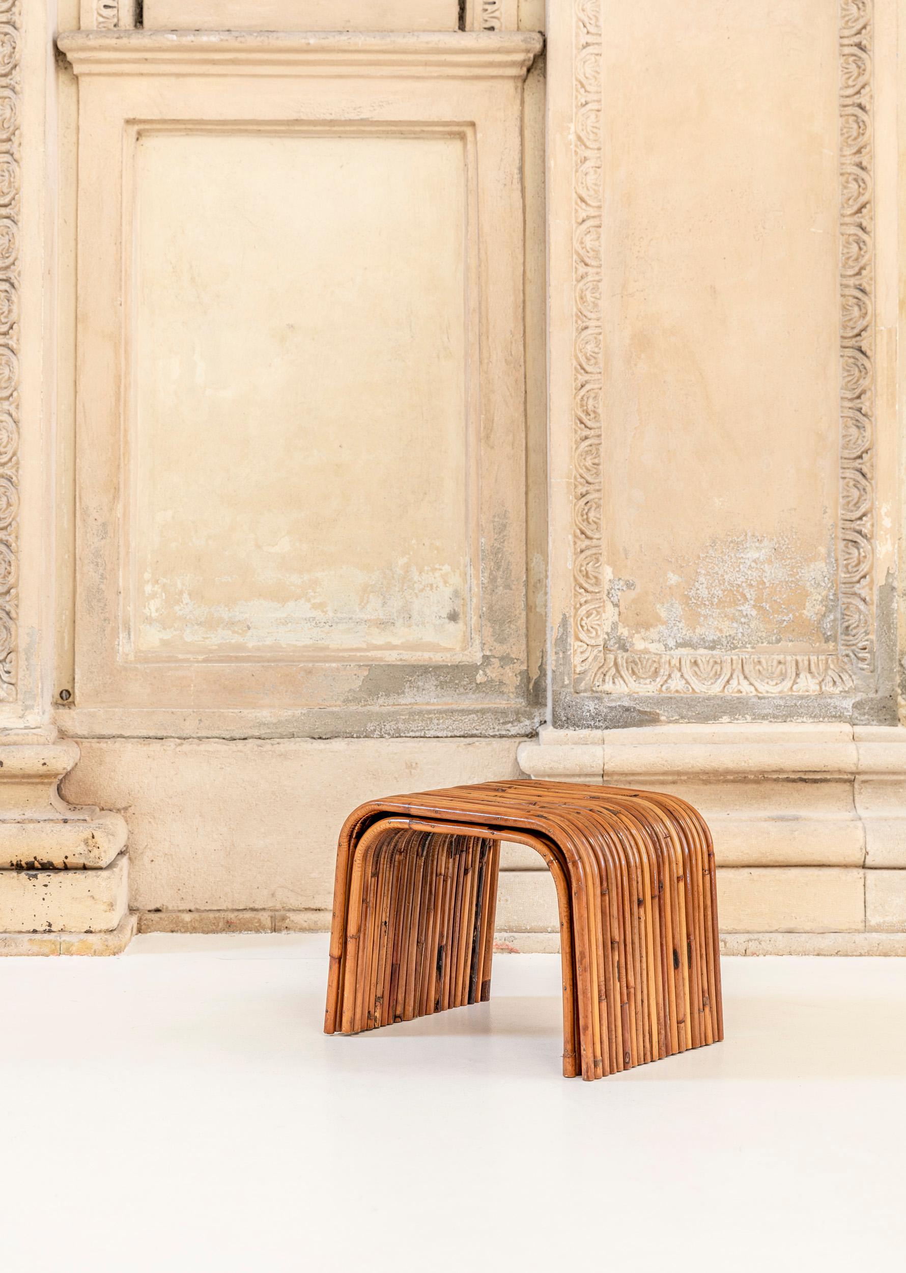 Pair of Gabriella Crespi bamboo nesting tables, Italy 1975. 
Bambu' collection from Rising sun serie.
These nesting tables can match with a console table and a mushroom Lamp.
Certificate by Archives Gabriella Crespi.

See the attaches