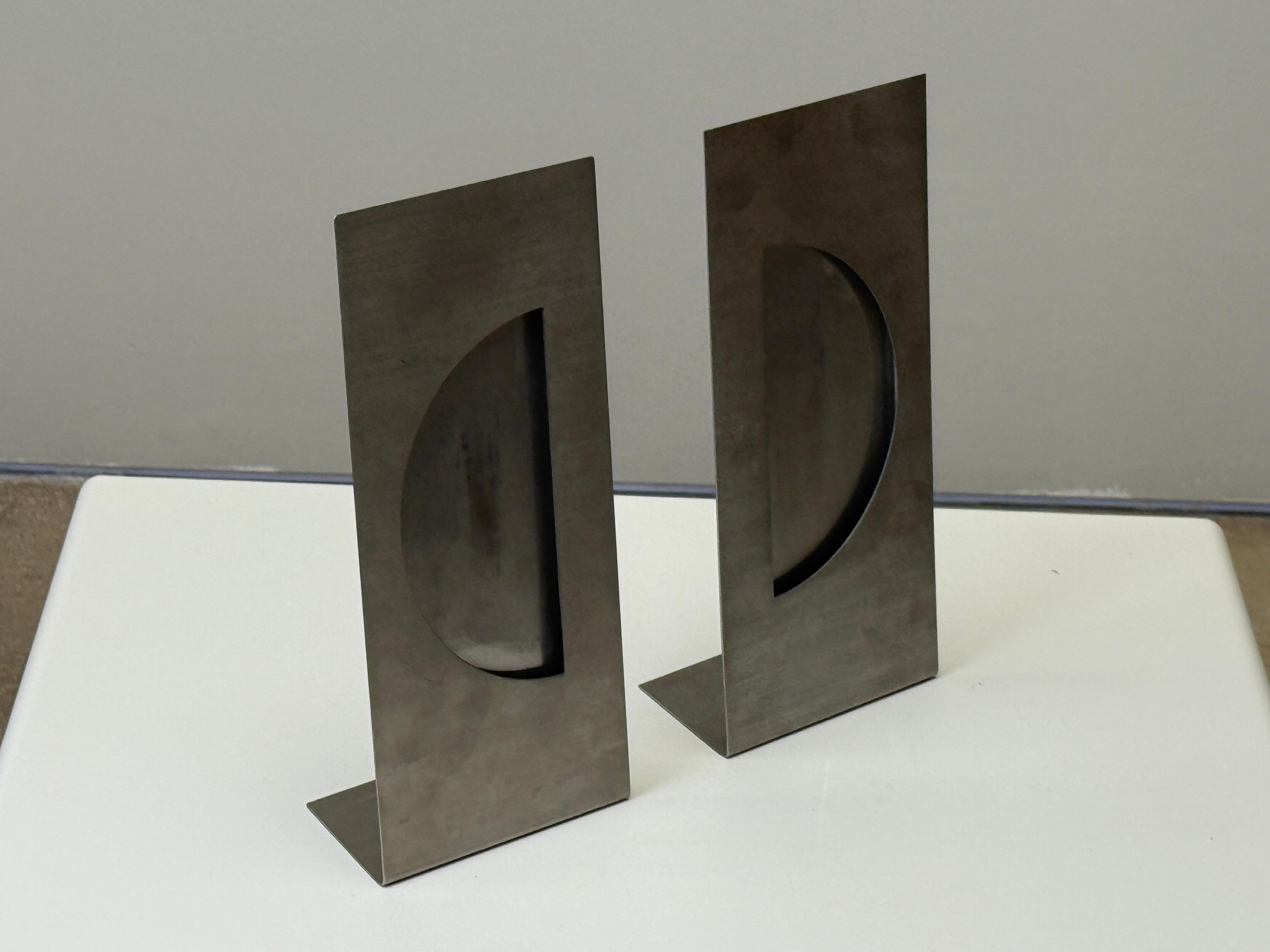 A pair of brushed steel picture or mirror frames designed and signed by Gabriella Crespi. 