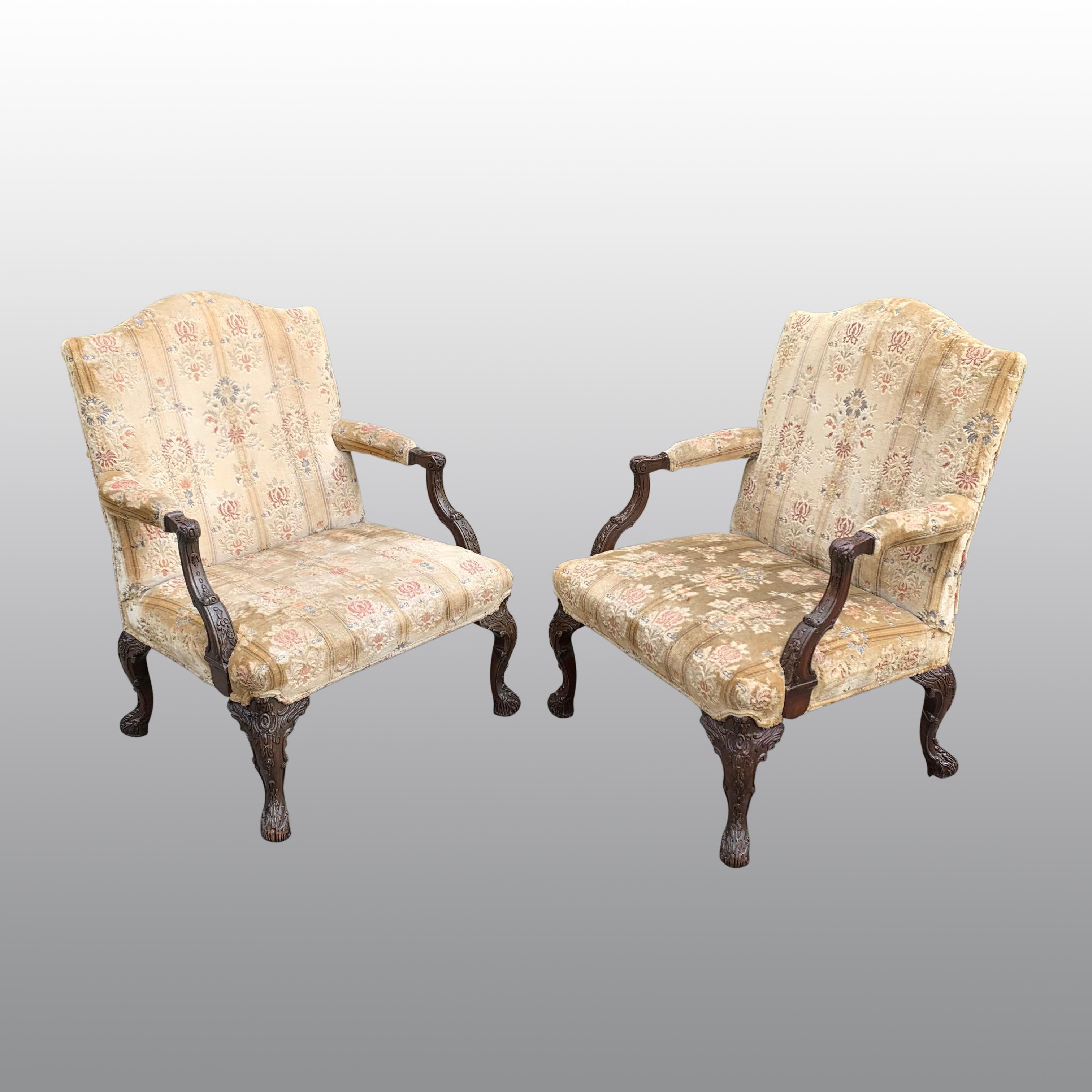 English Pair of Gainsborough Library chairs in the Chippendale taste For Sale