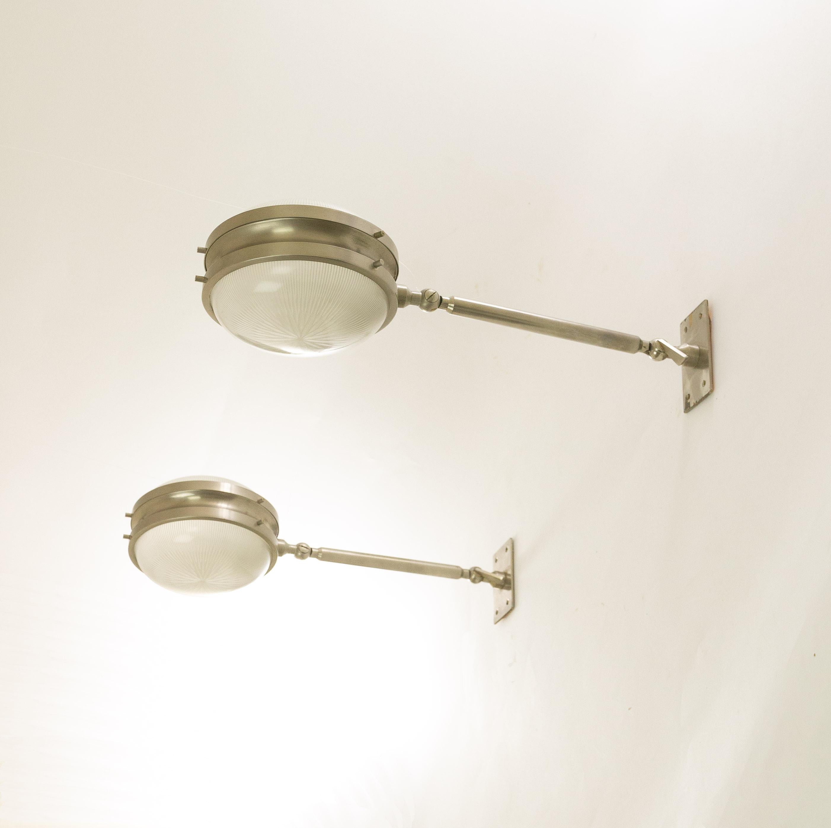 A pair of Gamma wall lamps designed by Sergio Mazza for Italian lighting manufacturer Artemide in the 1960s.

The lamps are adjustable. They have two hinges, at the beginning and end of the rod, that allow the lamps to be adjusted in different