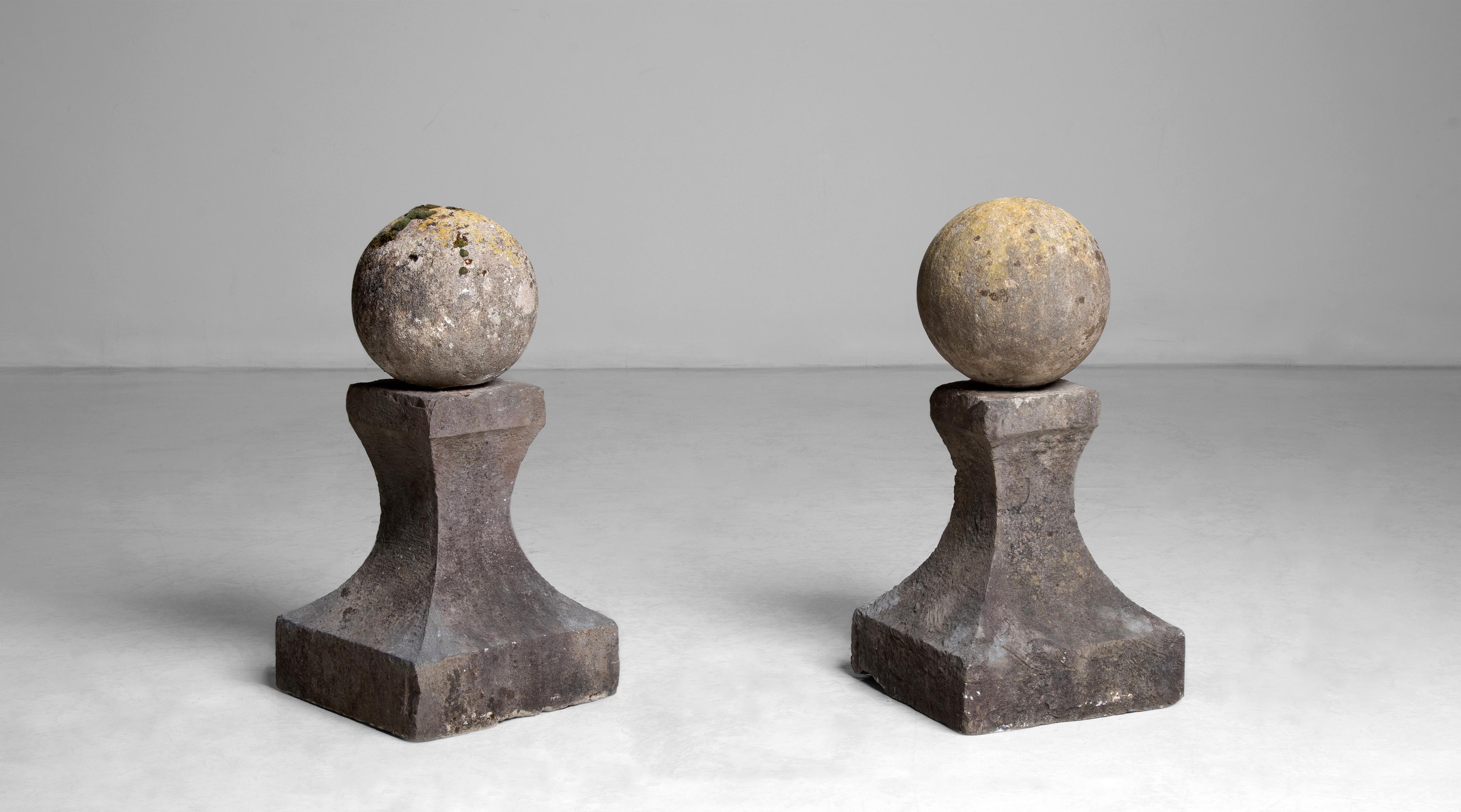 Pair of garden elements.
France circa 1890.
Cast stone spheres on tapered plinth.
Measures: 13”L x 13” D x 26.5” H.
 