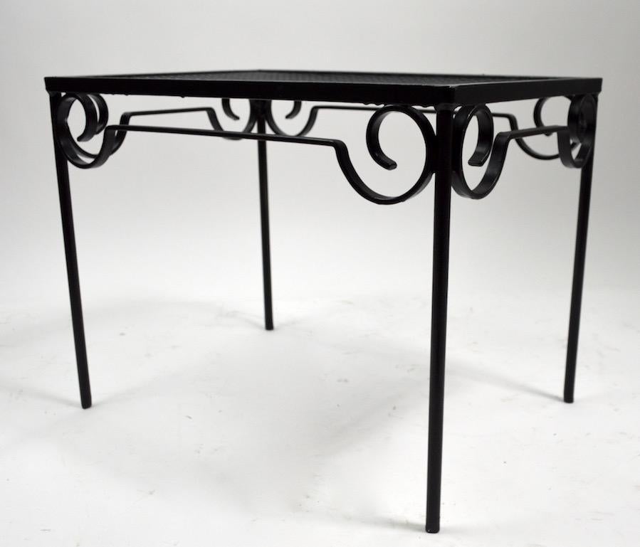 Pair of diminutive garden, patio tables, wrought iron frames with metal mesh tops. Both are recently painted in black semi gloss, suitable for both indoor and outdoor use.
Selling and priceas a pair, manufacture attributed to Salterini.
 