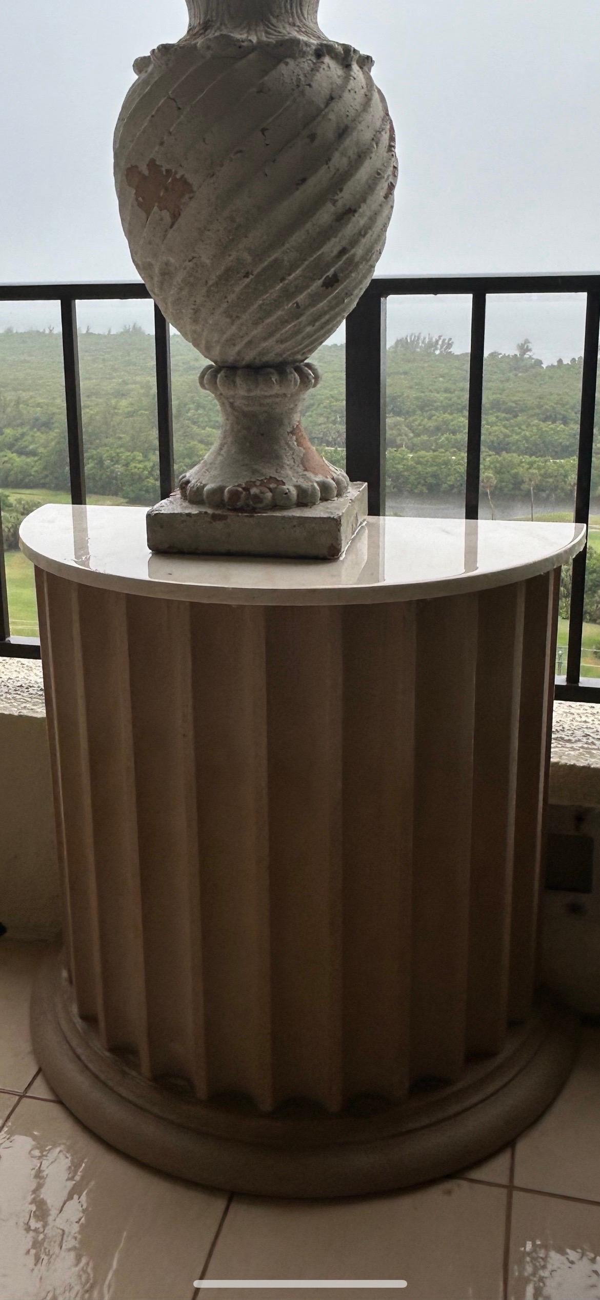 Marble Pair of garden tables with marble tops on fluted demilune cast sandstone bases For Sale