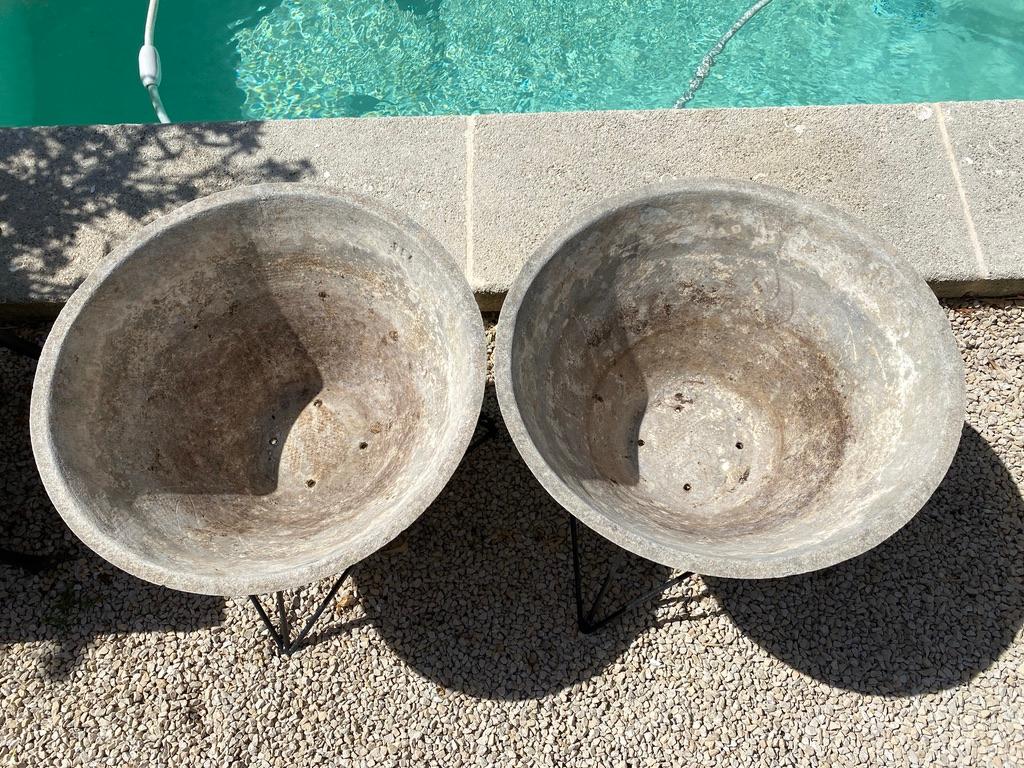 Pair of cement planters in the style of willy guhl 1960 on a removable blackened metal base. Good condition.