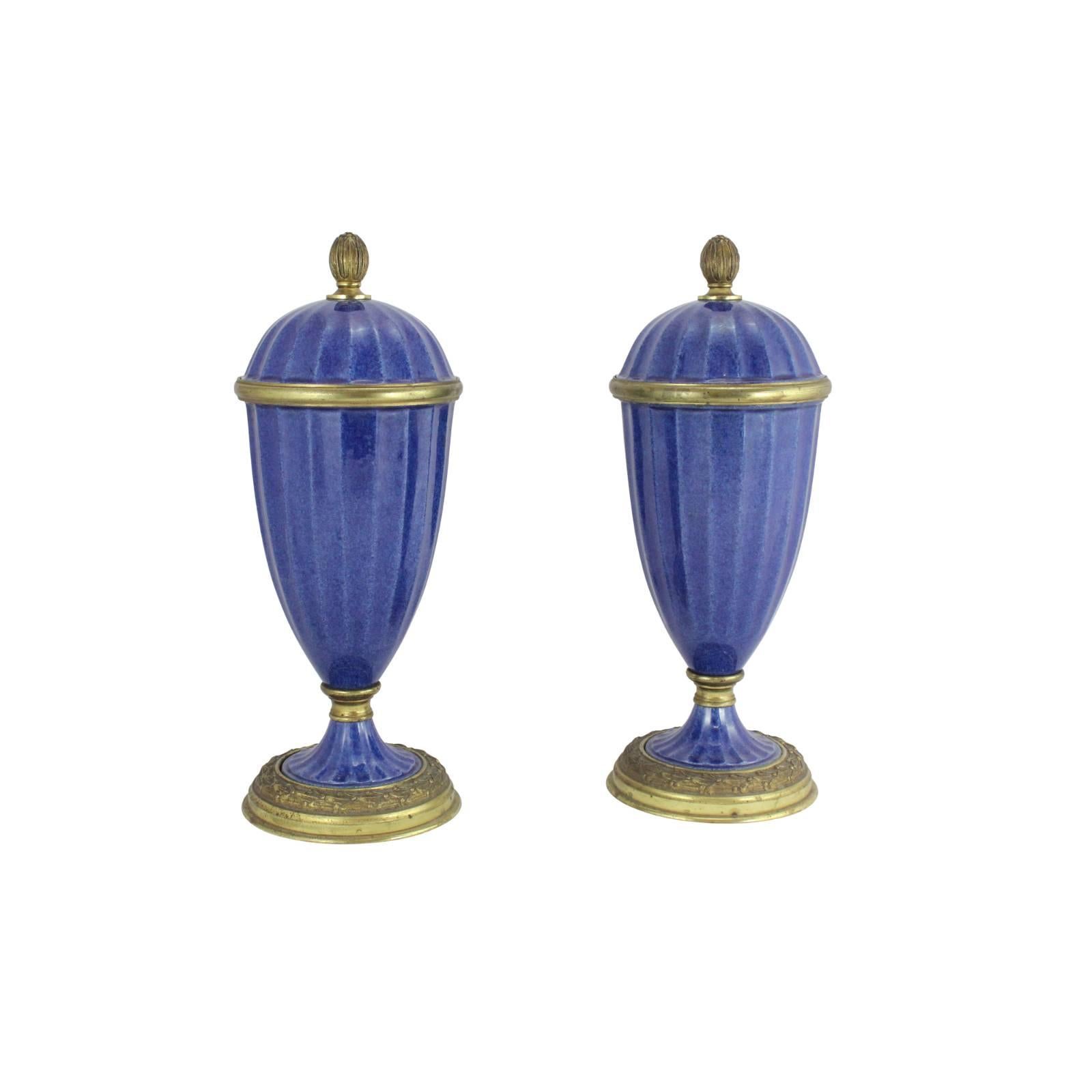 This beautiful pair of garniture with its lapis blue porcelain and gilt bronze mounts dates to between 1911 and 1930 from Sevres in France.
Here, the renowned designer Paul Milet, shows off his signature style with confidence and finesse. Standing