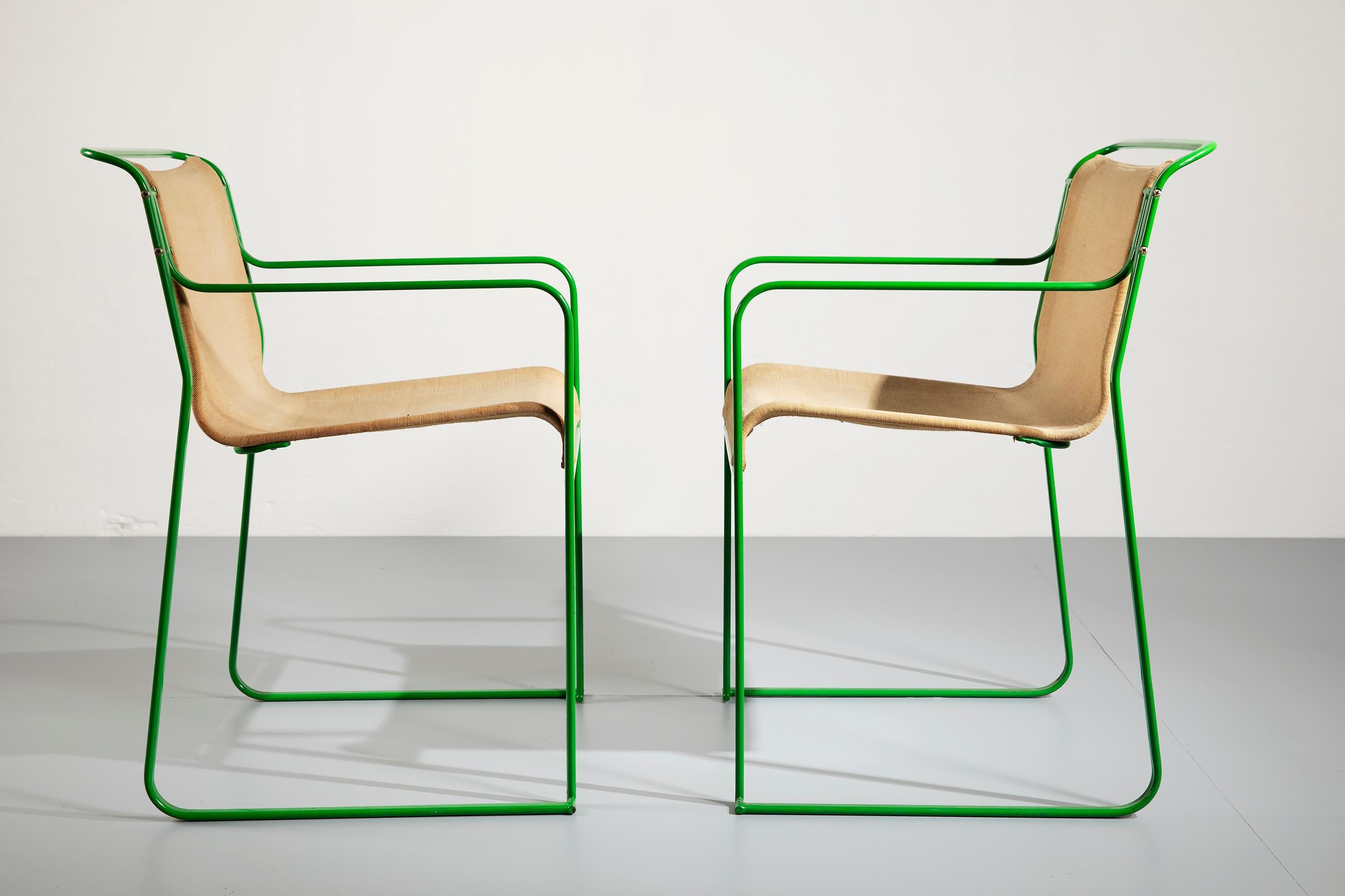 Pair of stackable armchairs designed by Gastone Rinaldi for his own company Thema, in 1979.
The chairs are very comfortable and both in very good conditions. The steel structure is solid, the green varnish has no big losses and the canvas has no