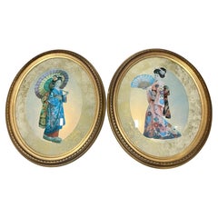 Pair of Geishas in Oval Convex Giltwood Frames