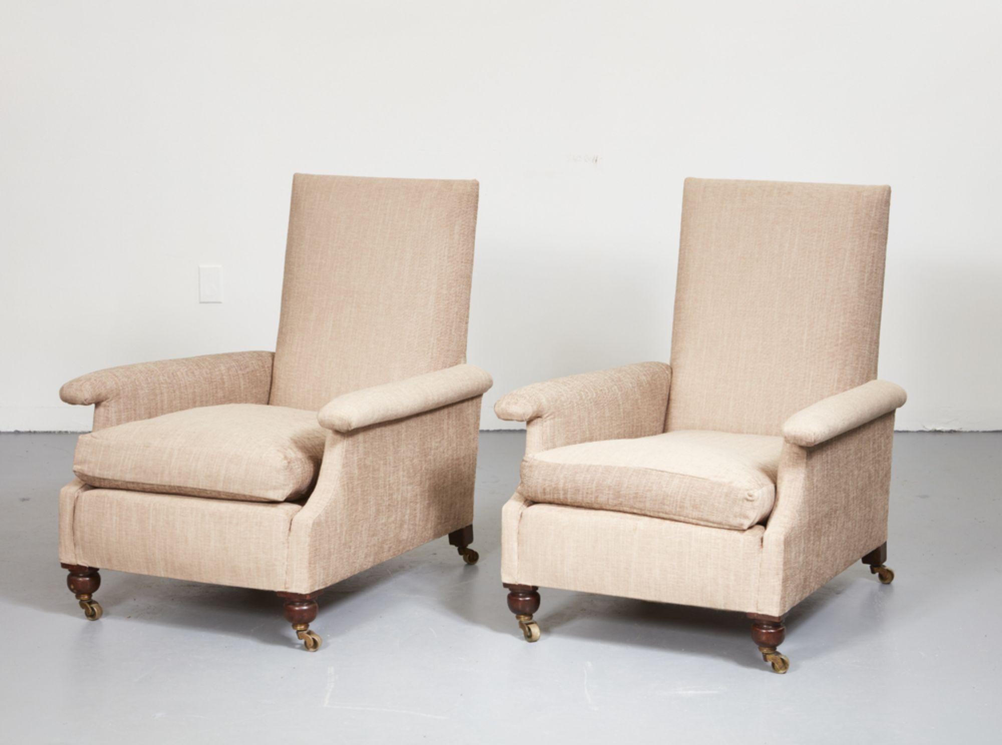 A 19th century pair of generously proportioned English club chairs newly upholstered in hand-woven cream colored Scottish tweed, with down filled seat cushions and extra down filled back custom designed back cushions, padded and railed arms and deep