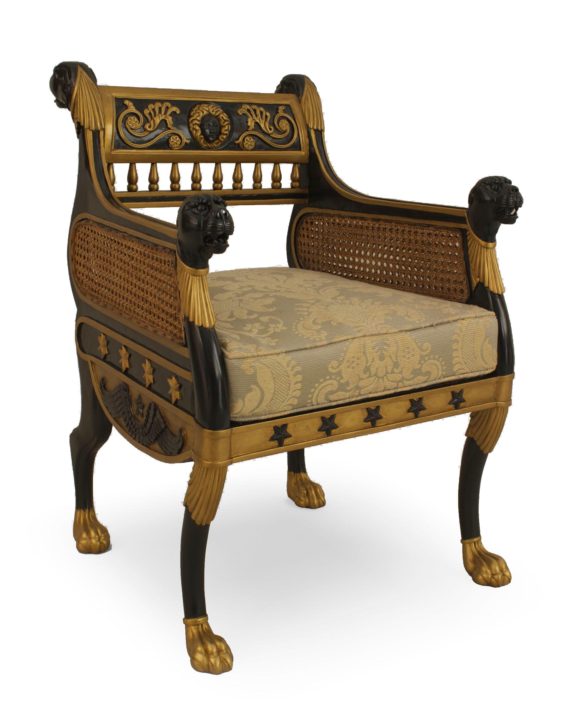 Pairof English Regency (20th Century) ebonized and gilt trimmed bergere Armchairs with cane sides and carved lion heads on back and arms. (Reproduction of Geo Smith design) .