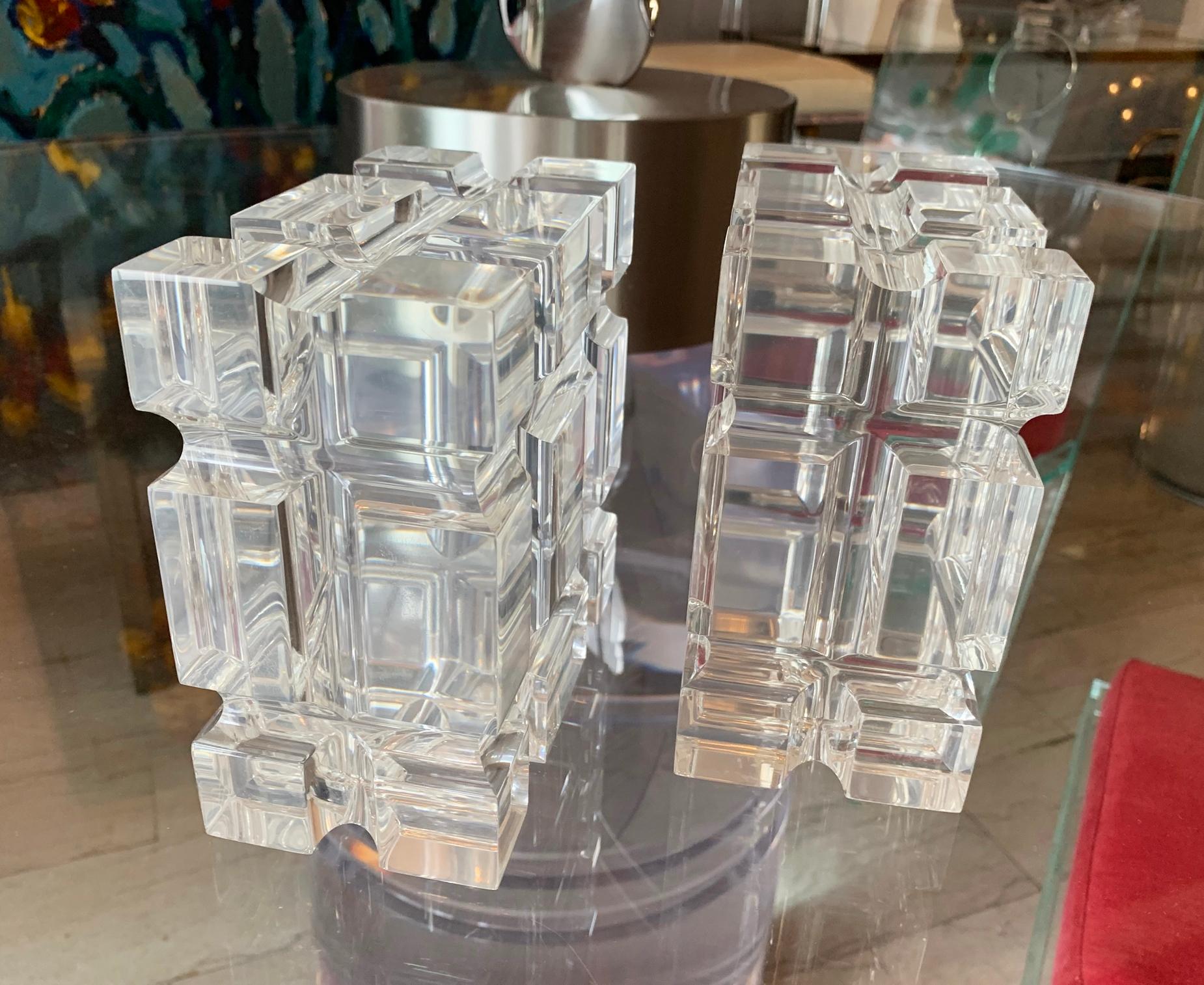 Stunning and beautiful pair of geometric bookends in polished Lucite designed by Amparo Calderon Tapia for Cain modern, the pieces have wonderful shapes and look beautiful against the light, they can be used as bookends or just