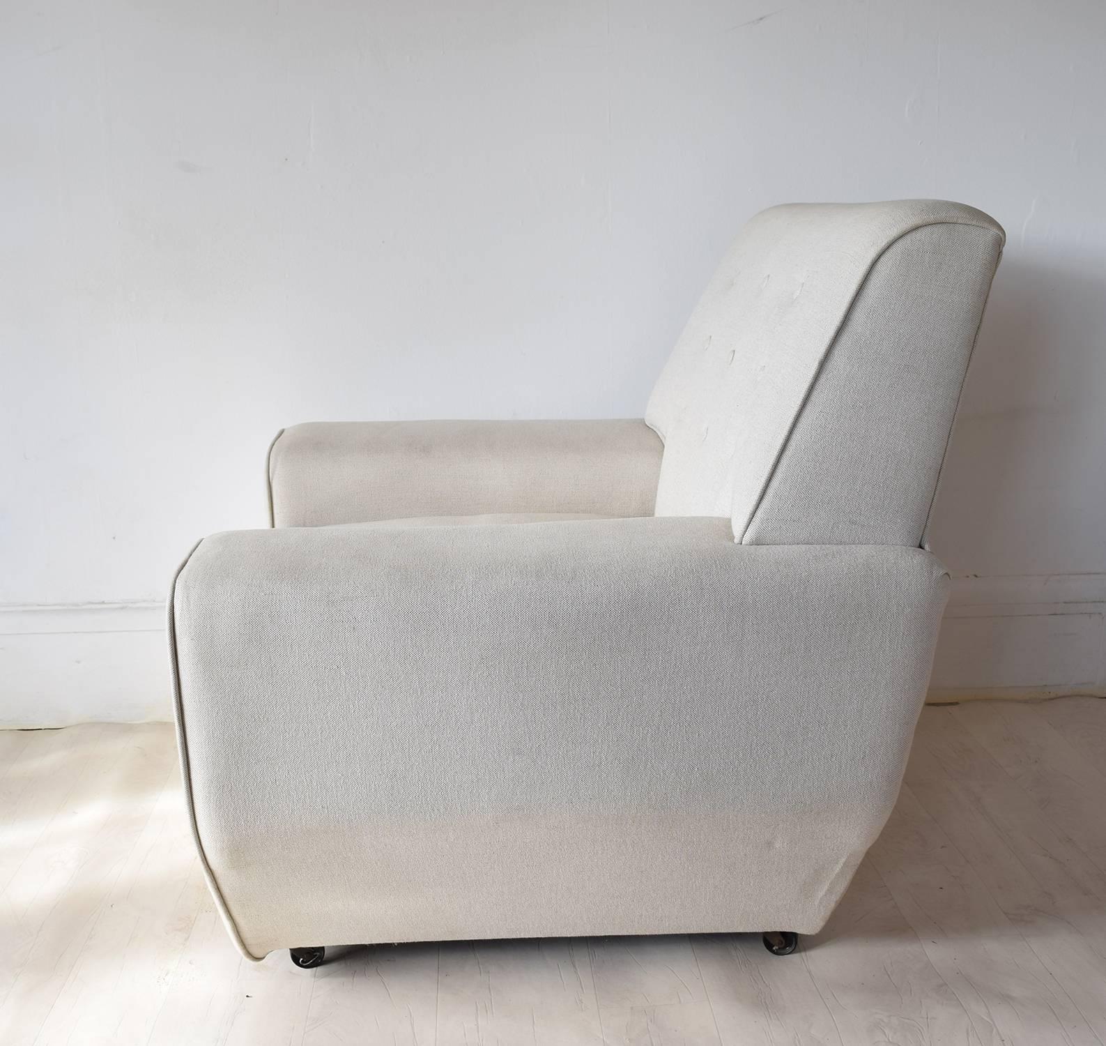 Very architectural shape.

Highly evocative of the 1960s.

They have been re-upholstered in a very smart ivory colored linen

Designer unknown.
 