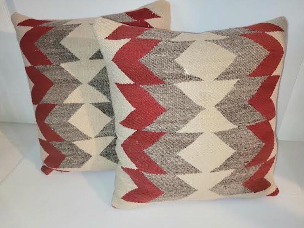Pair of Beautiful Geometric Navajo Pillows. Off white, taupe and red. Zipper casing. Down & feather fill.