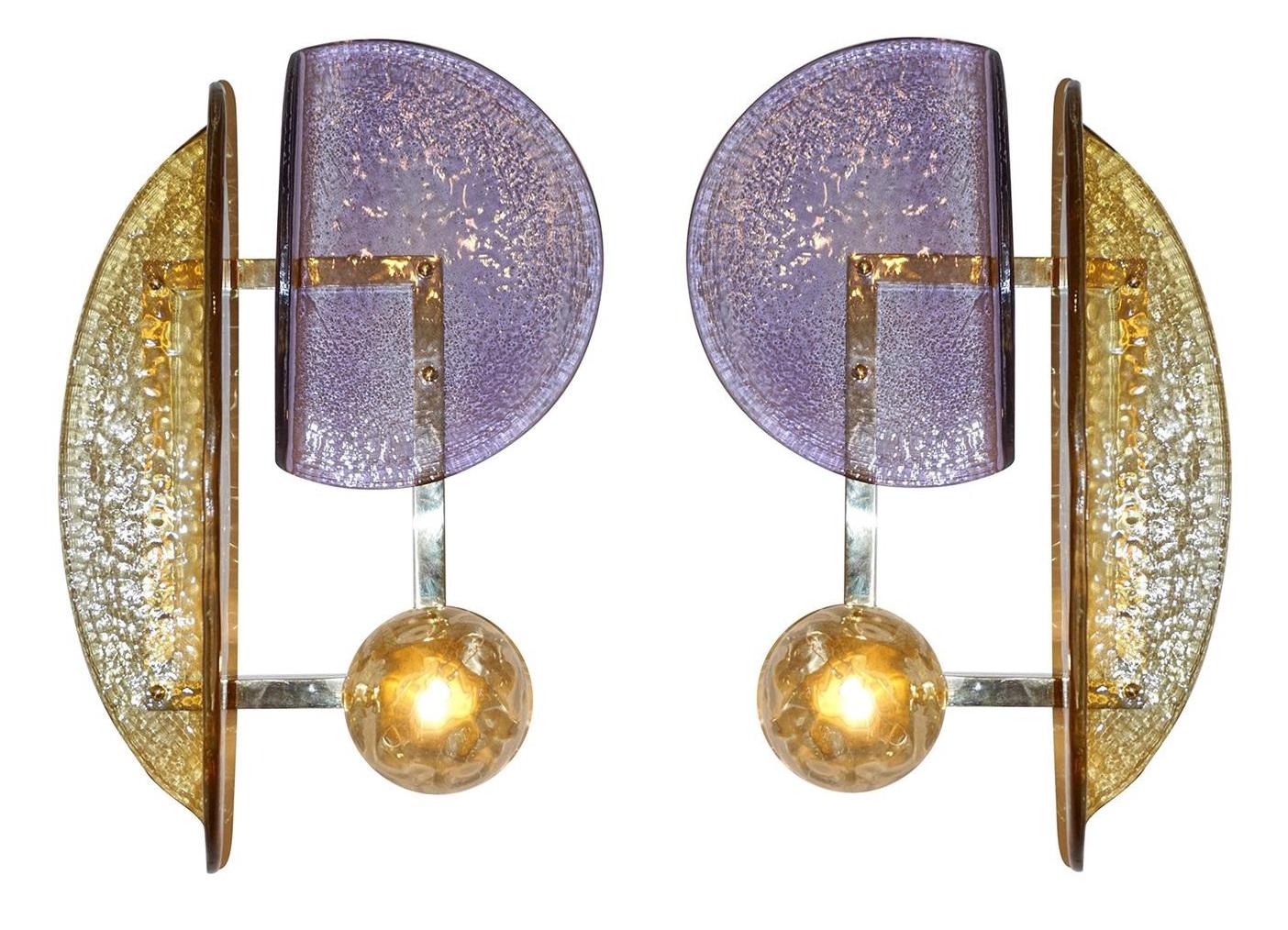 One of a kind pair of geometric wall lights, each wall light is composed of three Murano glass elements in purple, dark amber, and light amber globe, mounted on a rectangular brass frame / Made in Italy
Measures: Height 21 inches, width 14 inches,
