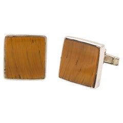 Par de gemelos geométricos de plata de ley con incrustaciones de ojo de tigre