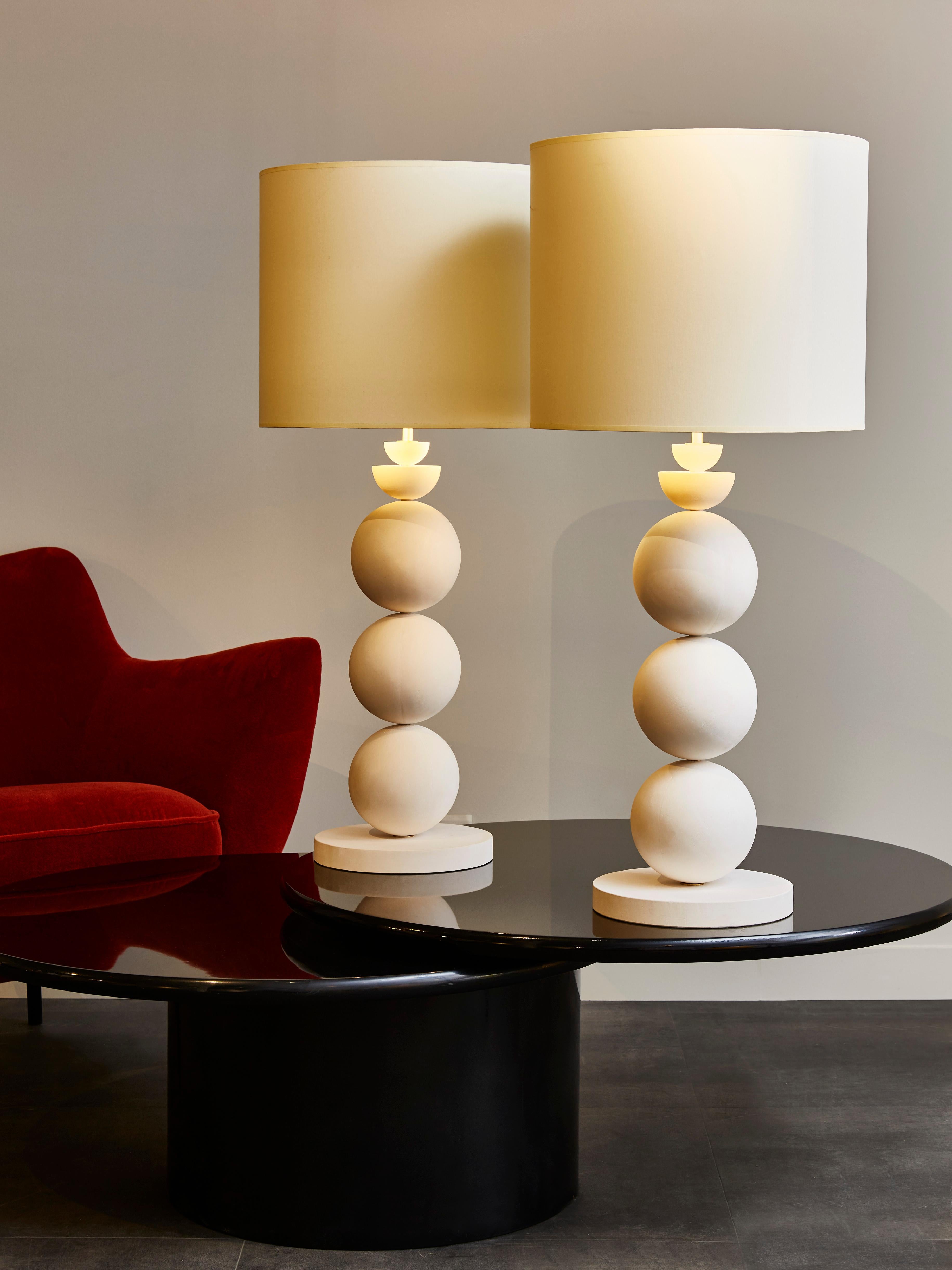Pair of elegant table lamps made of stacked plaster globes.

 
